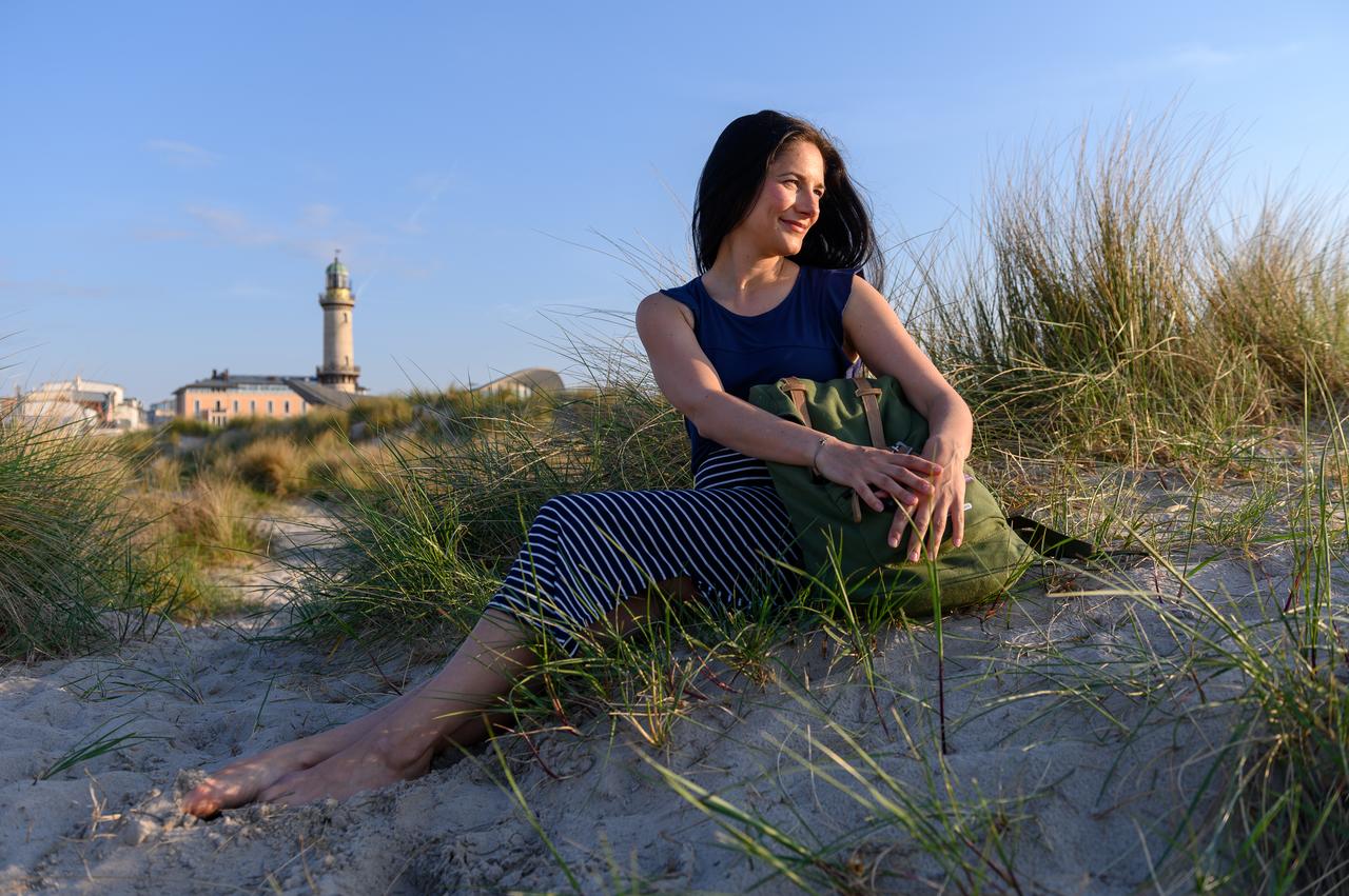 People in nature, Flash photography, Hair, Sky, Lighthouse, Plant, Ecoregion, Happy, Sunlight, Grass