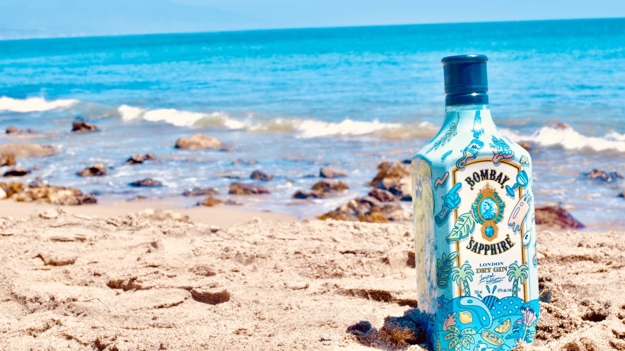 Glass bottle, Alcoholic beverage, Water, Liquid, Sky, Drinkware, Blue, Fluid, Beach