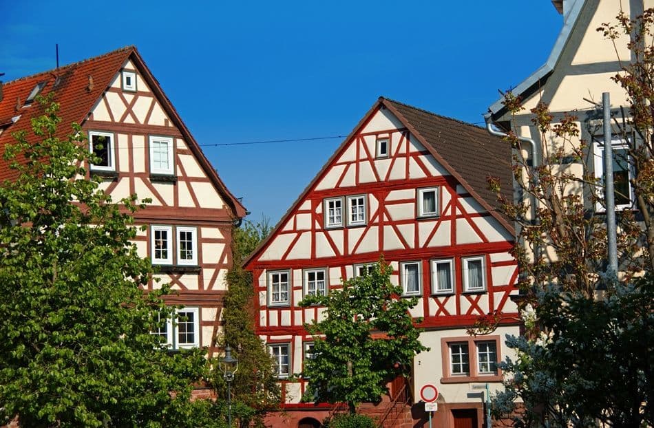 Residential area, Urban design, Building, Sky, Property, Window, Plant, House, Tree, Fixture