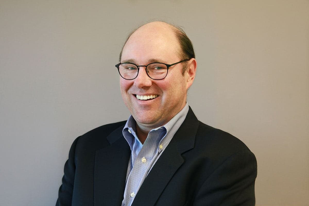 Vision care, Dress shirt, Smile, Glasses, Chin, Sleeve, Gesture, Collar, Eyewear