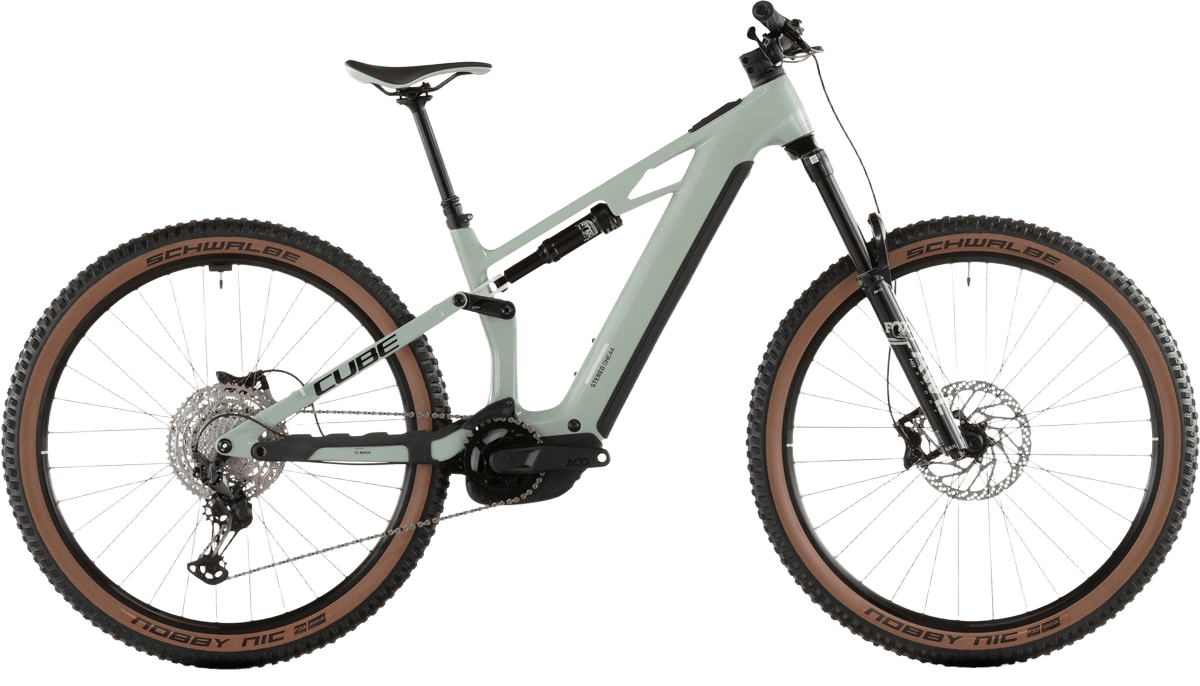A light green full-suspension electric mountain bike with brown-walled tires on a white background.