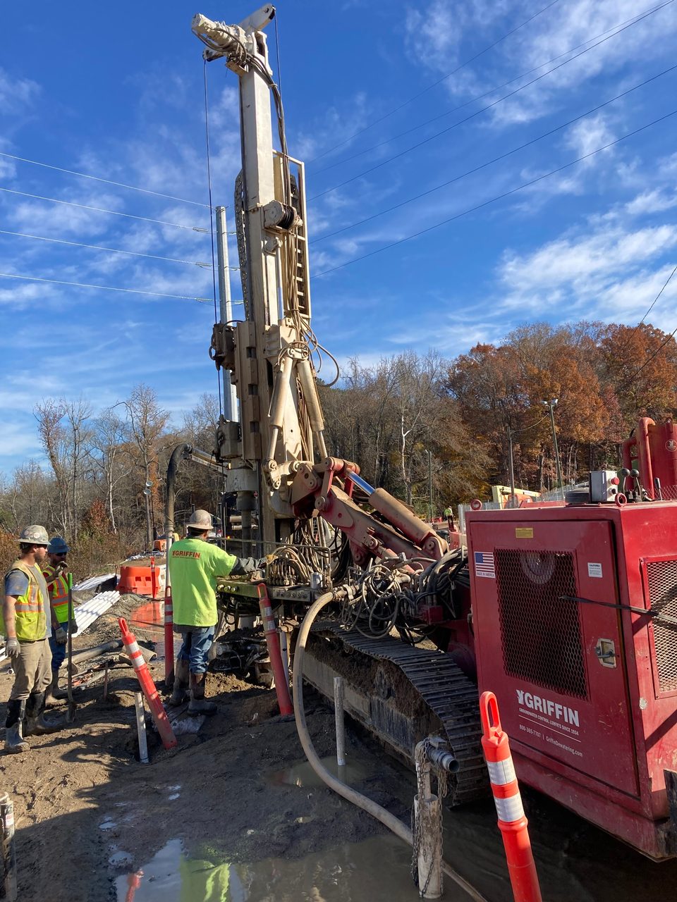 Motor vehicle, Road surface, High-visibility clothing, Automotive tire, Sky, Cloud, Wheel, Asphalt, Tree