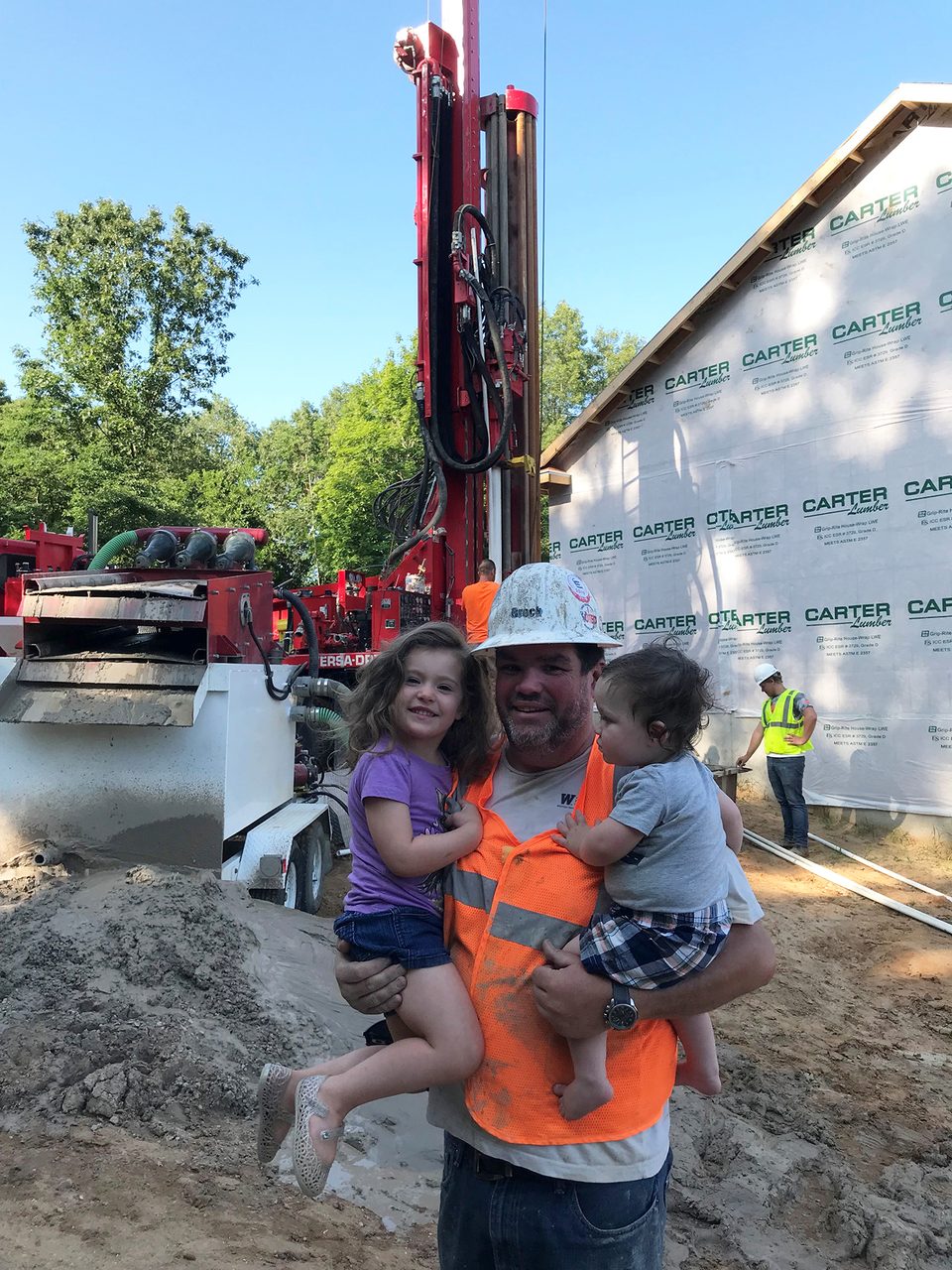 Automotive tire, Woody plant, Sky, Shorts, Hat, Tree, Travel, Asphalt, Sunglasses