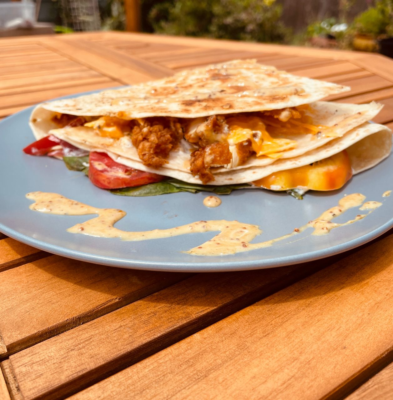Wooden table, Outdoors, Plate, Quesadilla, Chicken, Vegetables, Sauce