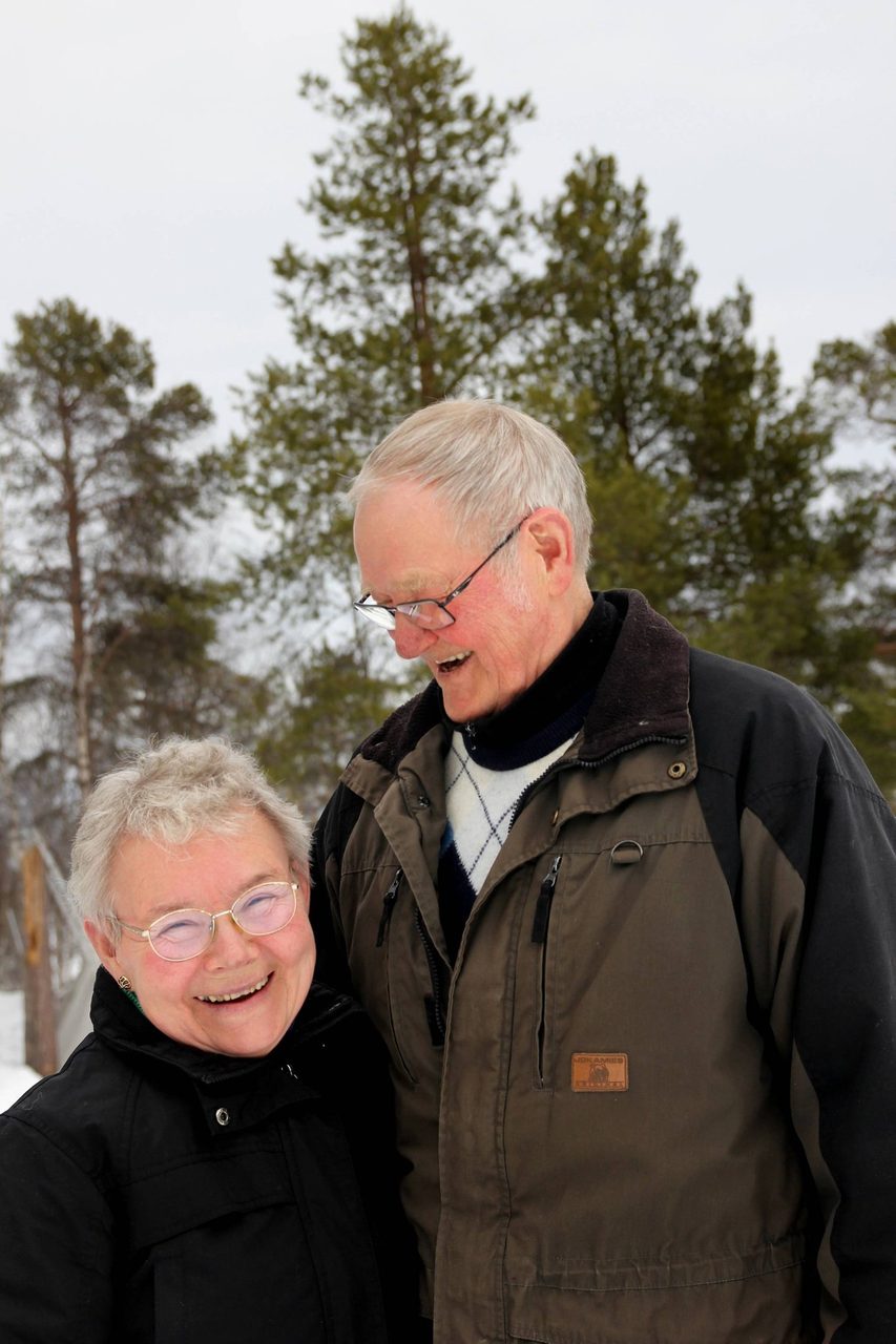 Vision care, Glasses, Sky, Smile, Tree, Gesture, Eyewear, Jacket