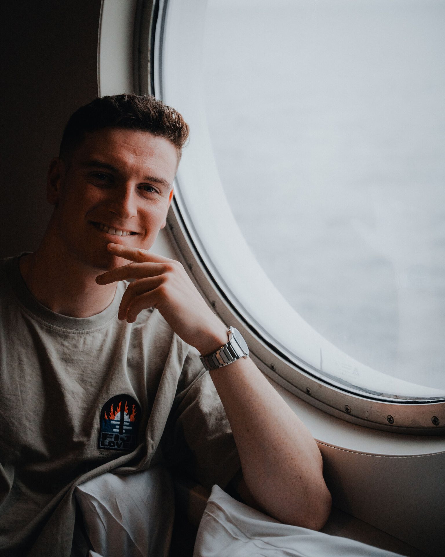 Facial expression, Flash photography, Watch, Chin, Hairstyle, Comfort, Window, Gesture, Fun