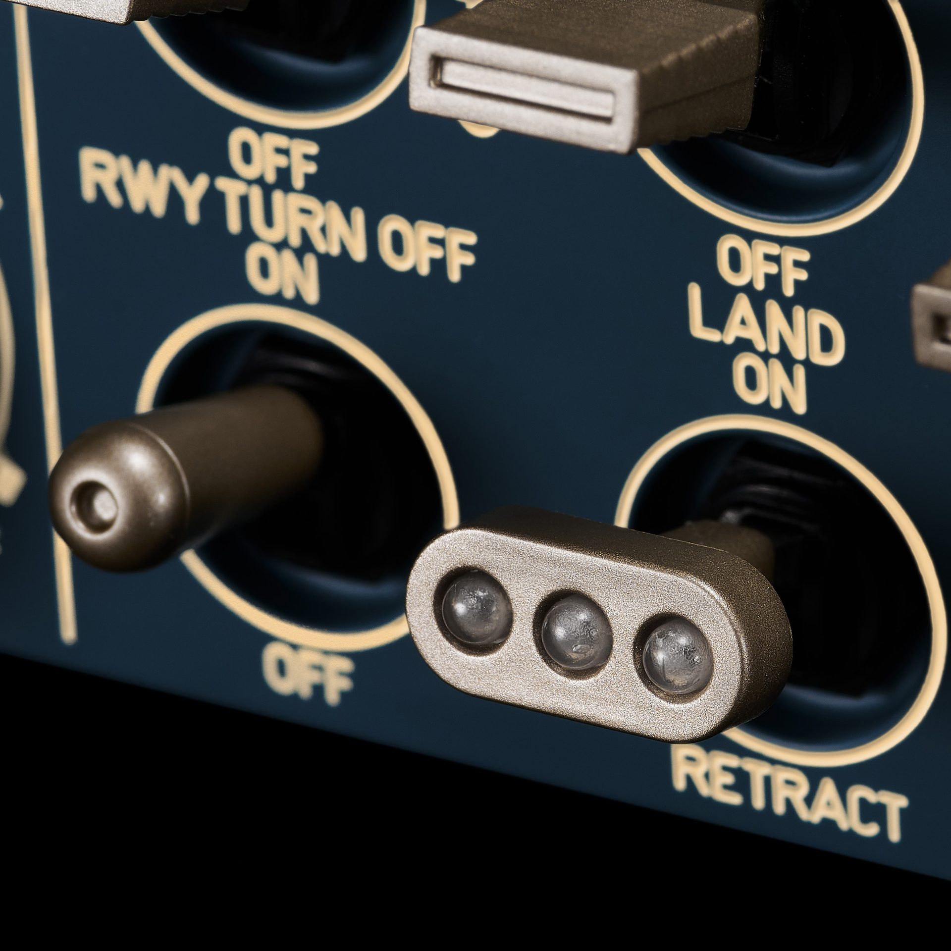Dark blue aircraft panel with switches: RWY TURN, LAND, RETRACT.