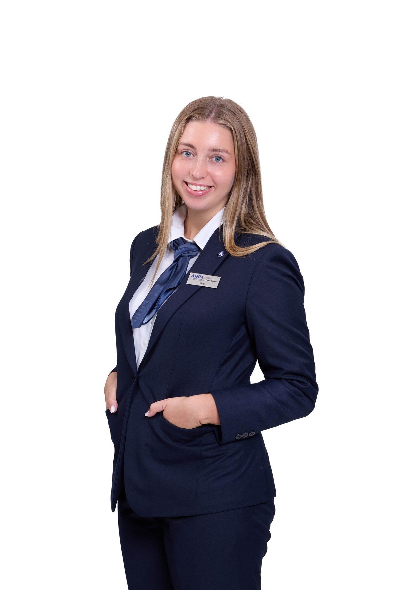 Formal wear, Facial expression, Dress shirt, White-collar worker, Smile, Sleeve, Collar, Standing, Blazer, Uniform