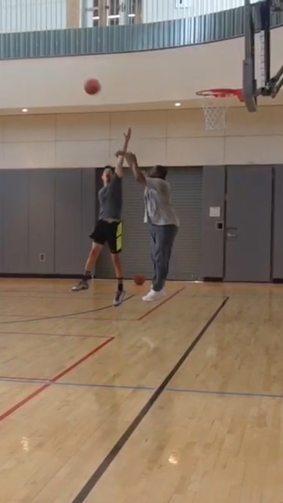 Basketball hoop, Field house, Sports equipment, Shorts, Wood, Ball, Floor, Player