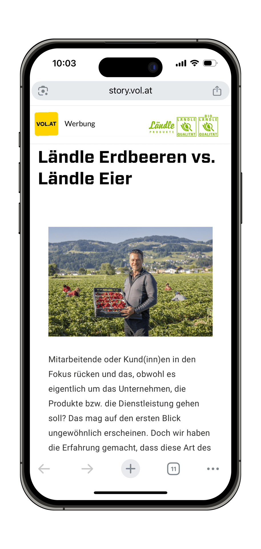 Smartphone displaying an ad webpage: "Ländle Erdbeeren vs. Ländle Eier", with a man in a strawberry field.
