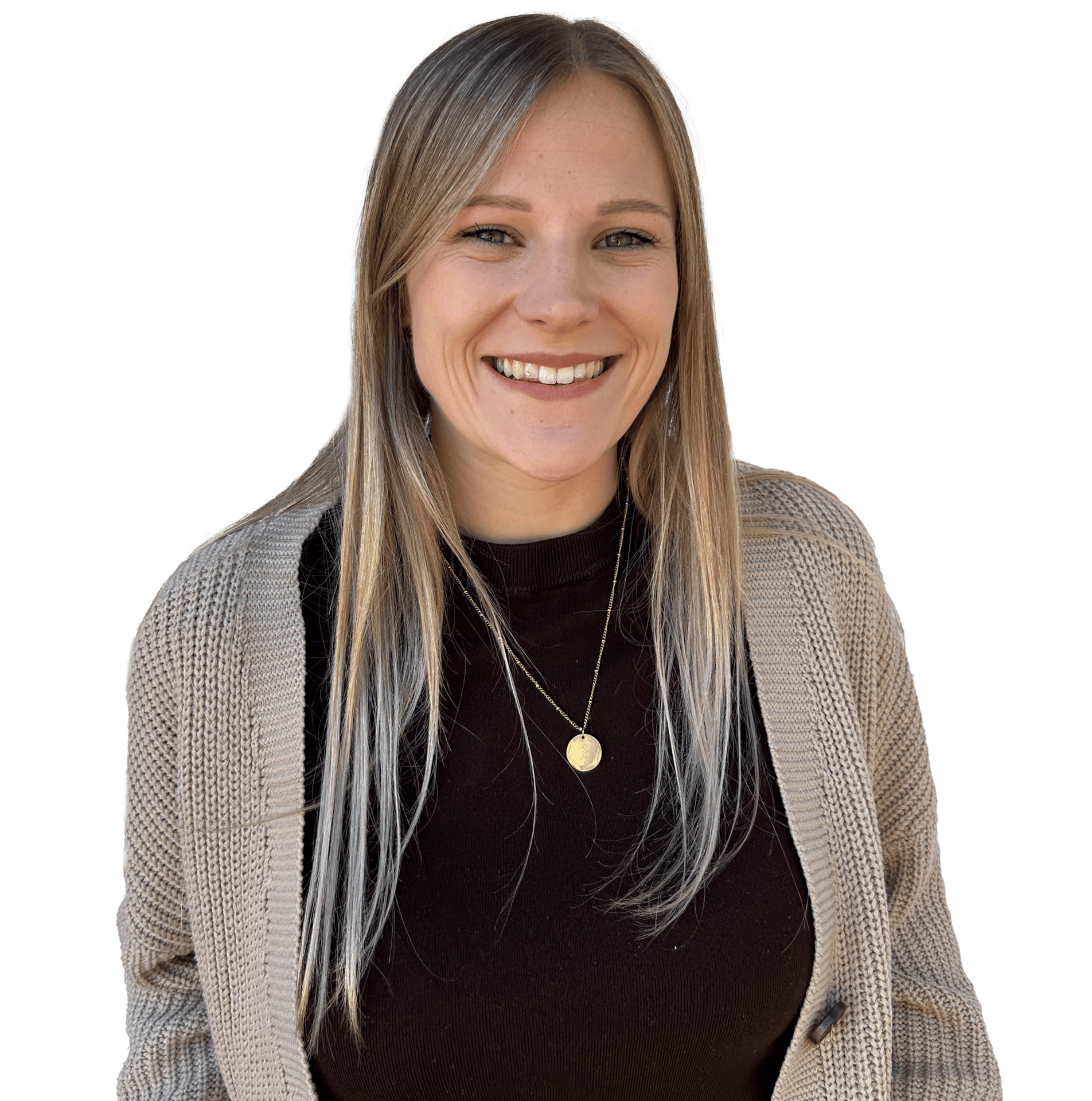 A happy woman with long blonde hair, wearing a black top and a beige cardigan.