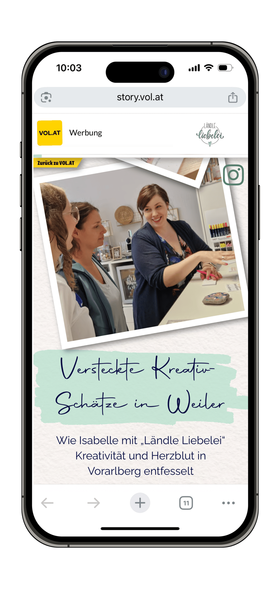 A smartphone displaying an article about "Ländle Liebelei" with women in a creative workshop setting.
