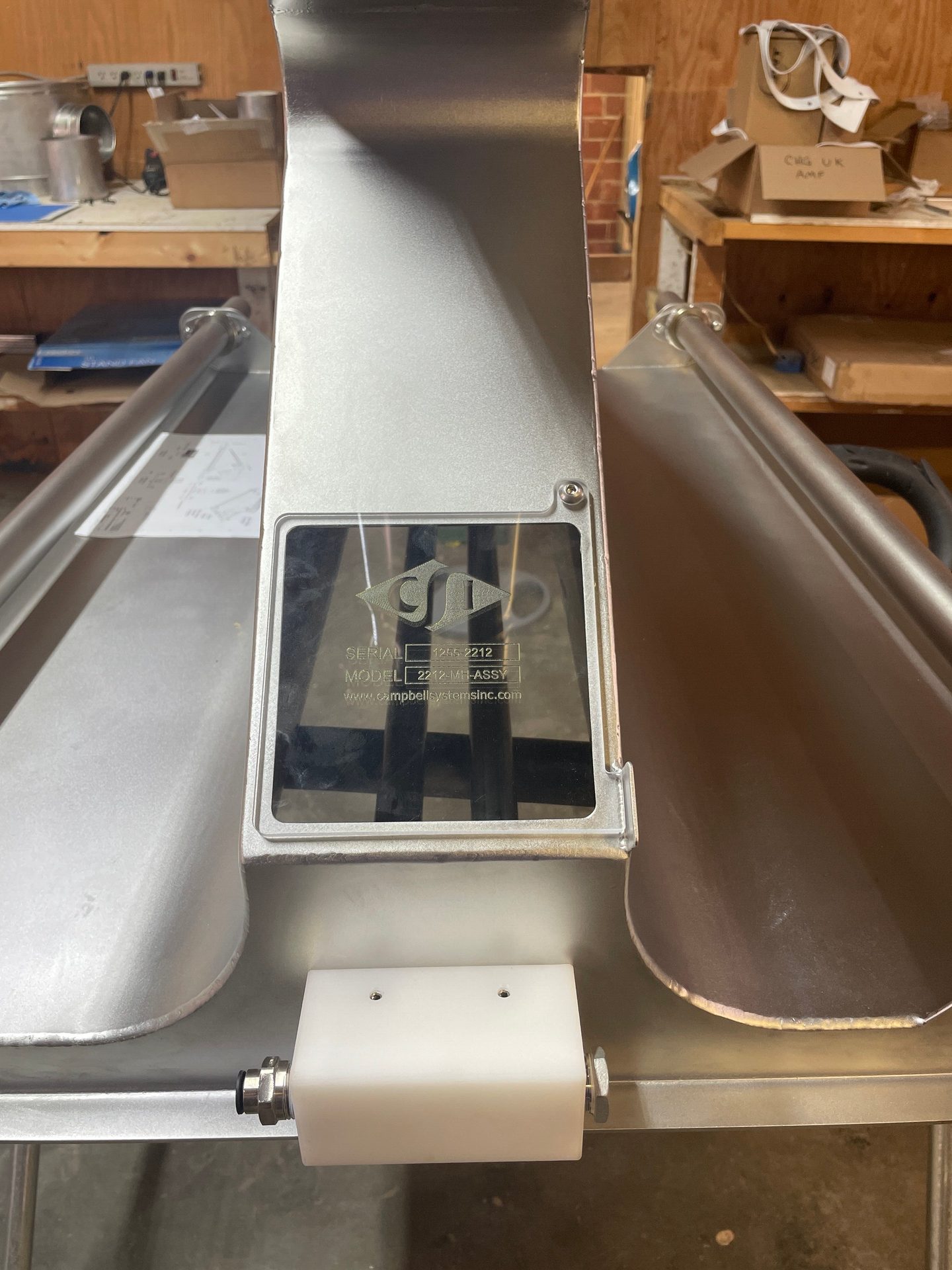 Stainless steel industrial machine with Campbell Systems Inc. label showing model 2212-MH-ASSY.