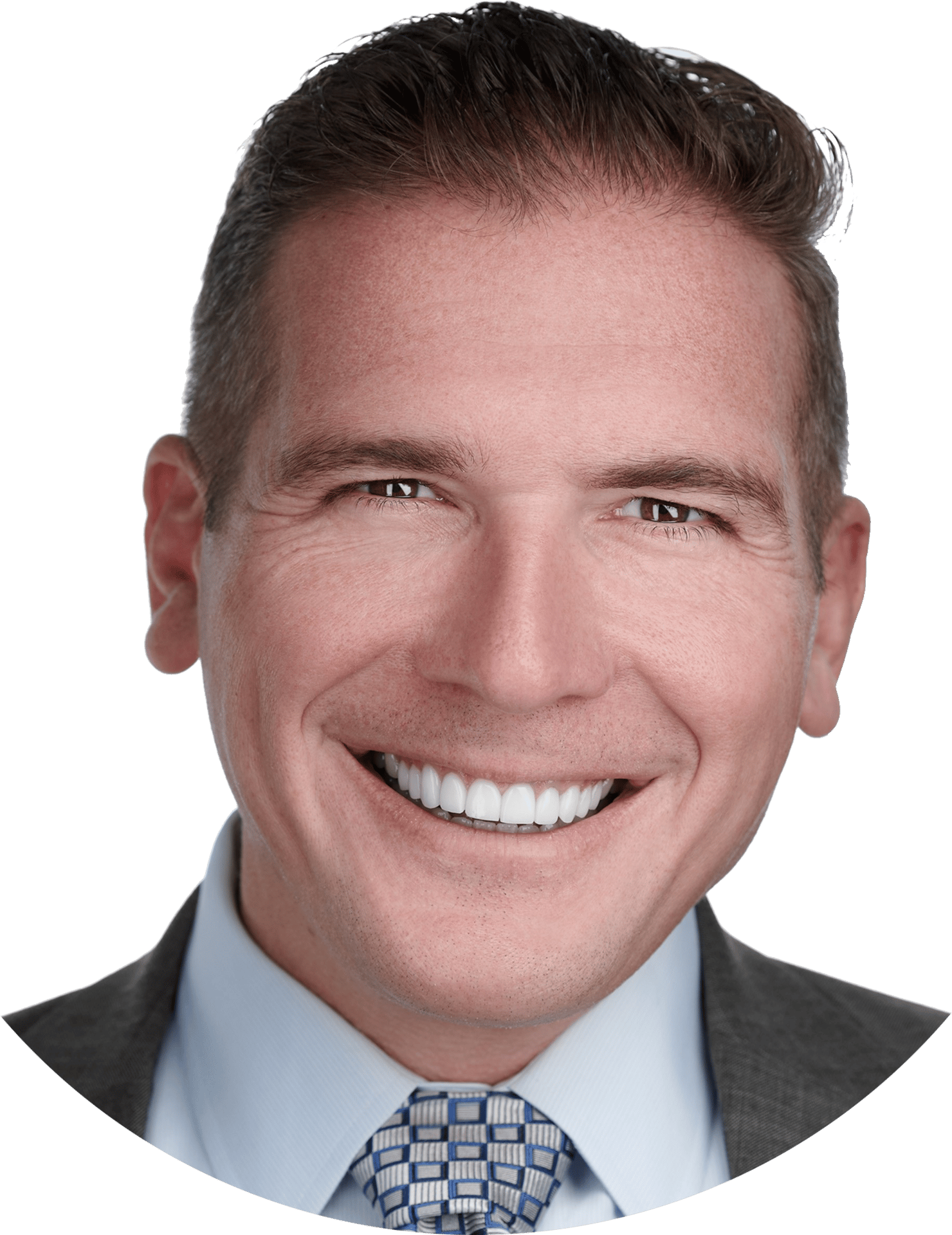 Smiling man in a suit and tie.