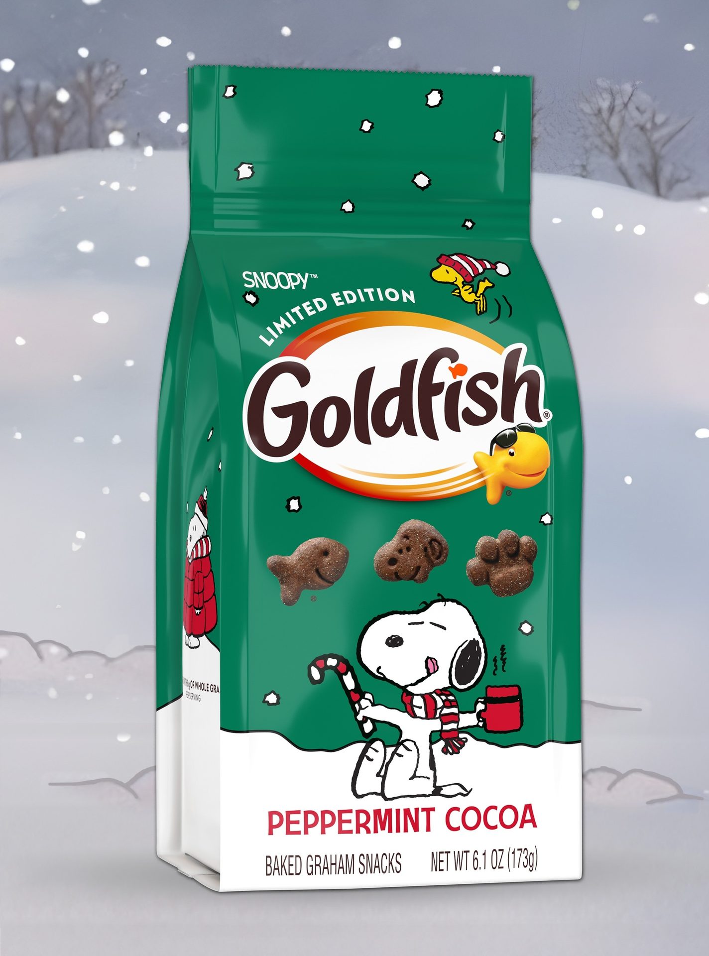 Green Goldfish Peppermint Cocoa Snoopy Limited Edition Baked Graham Snacks bag in snow.