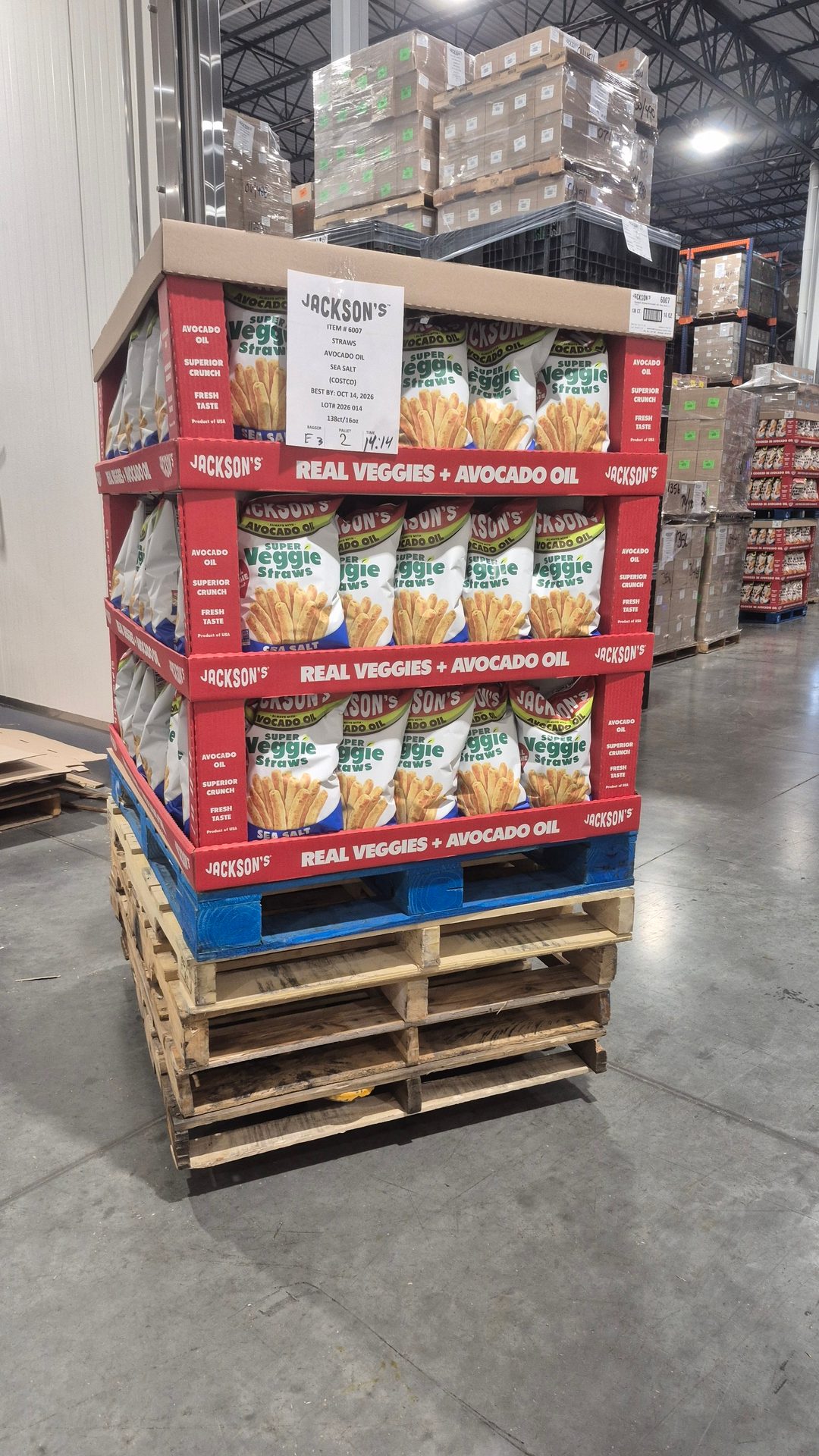 A pallet display of Jackson's Super Veggie Straws with avocado oil in a warehouse.