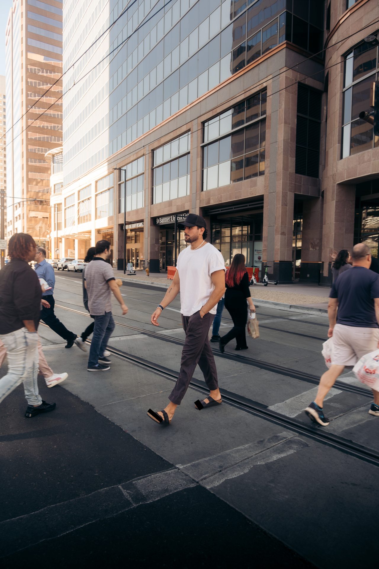 Road surface, Zebra crossing, Urban design, Building, Leg, Asphalt, Gesture, Sidewalk