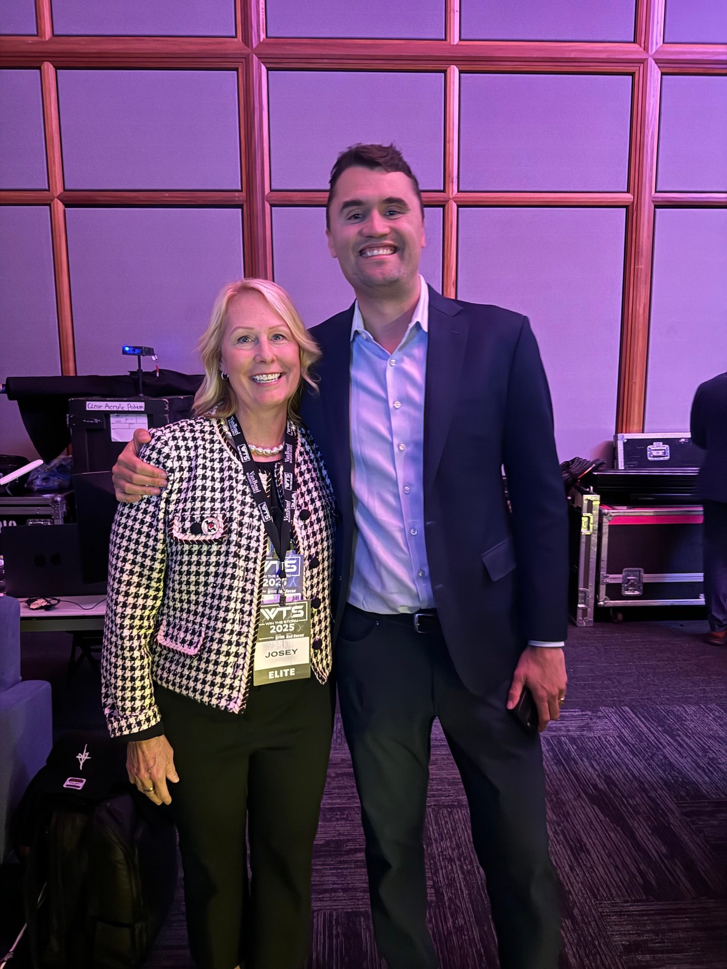 Smiling woman (Josey, Elite) and man at a VTS 2025 event, arm around her.