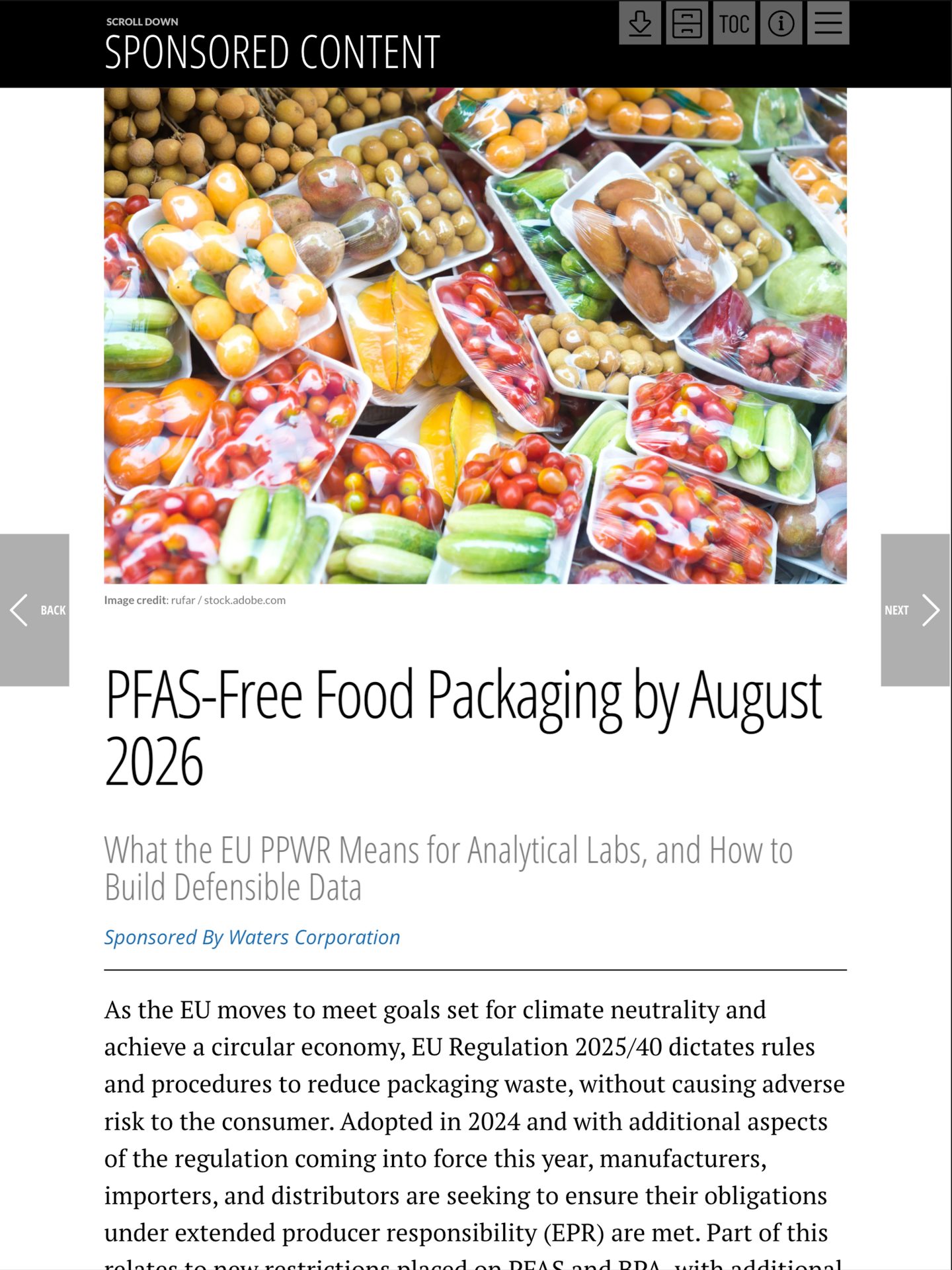 Assorted fruits and vegetables in plastic and foam packaging, stacked in a retail display.