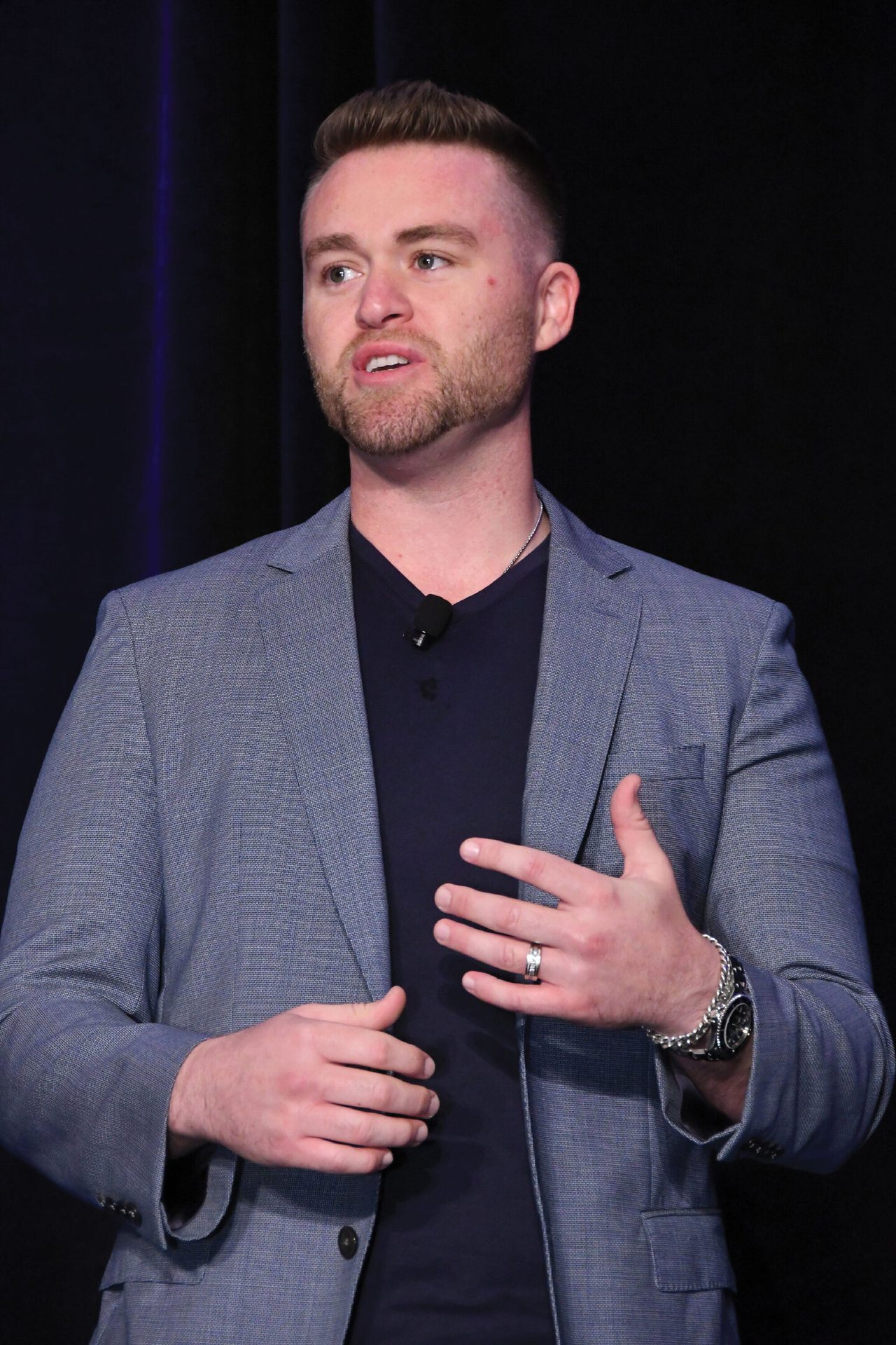 Cheek, Chin, Hand, Watch, Arm, Muscle, Sleeve, Beard, Gesture, Collar