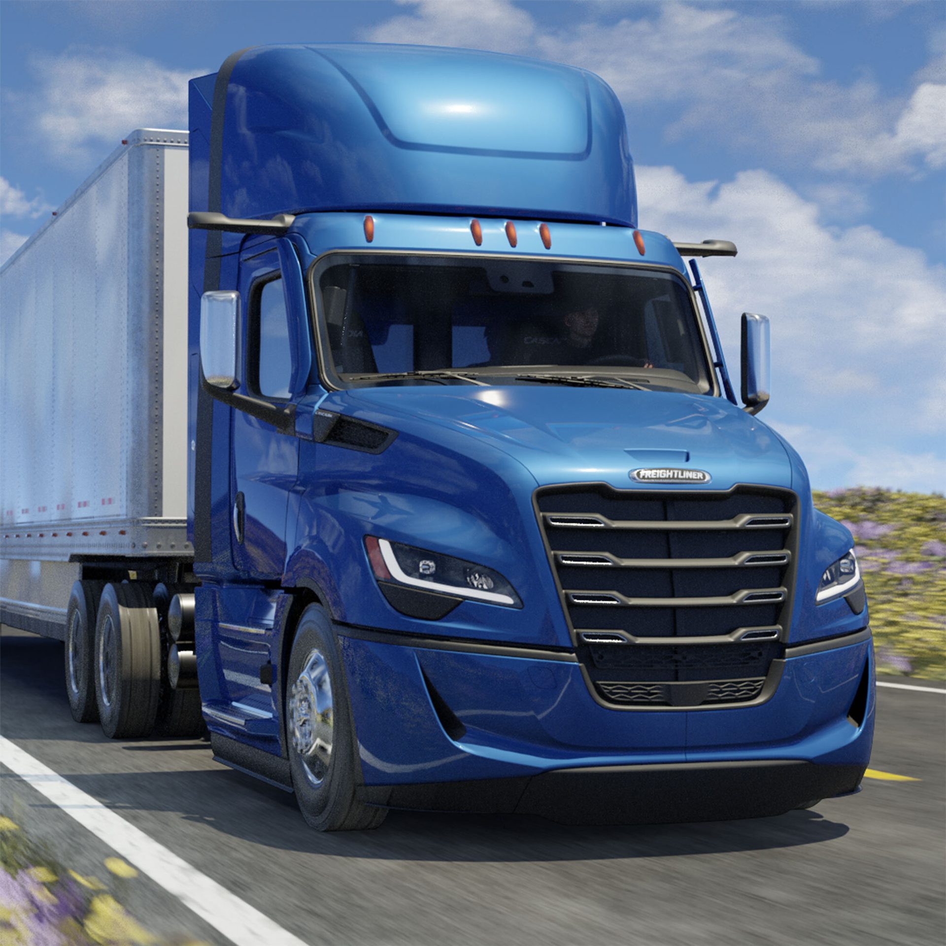 A blue Freightliner semi-truck with a trailer drives on a road under a blue sky.