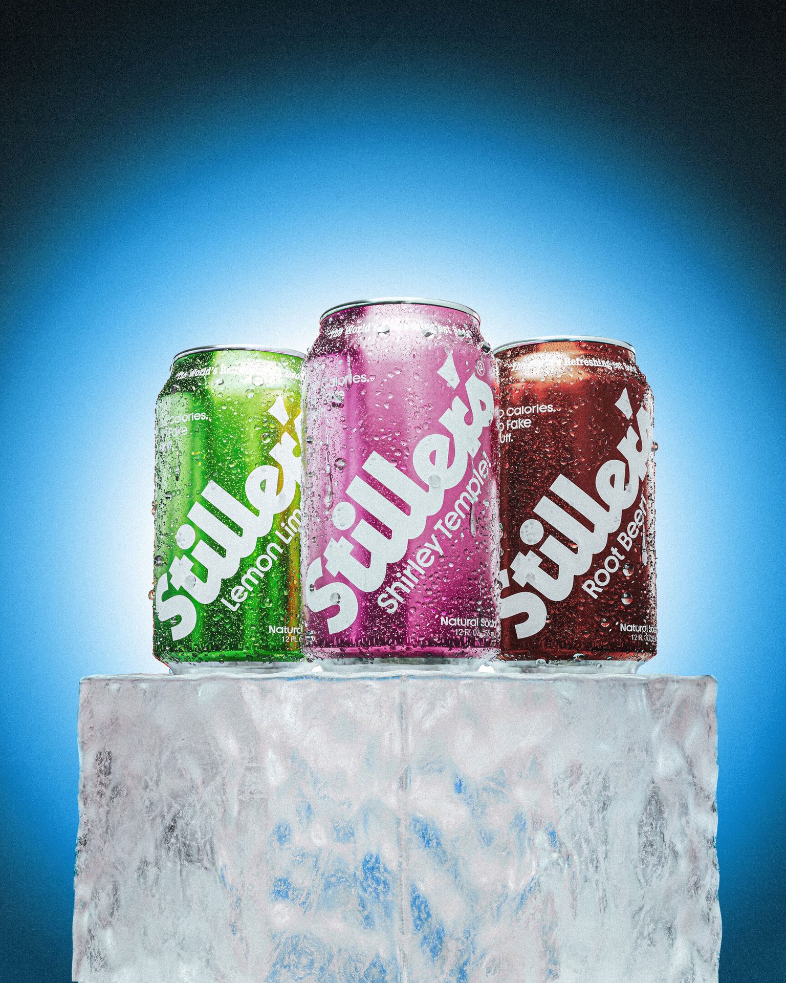 Three cold Stillers soda cans (Lemon Lime, Shirley Temple, Root Beer) with condensation, on an ice block.
