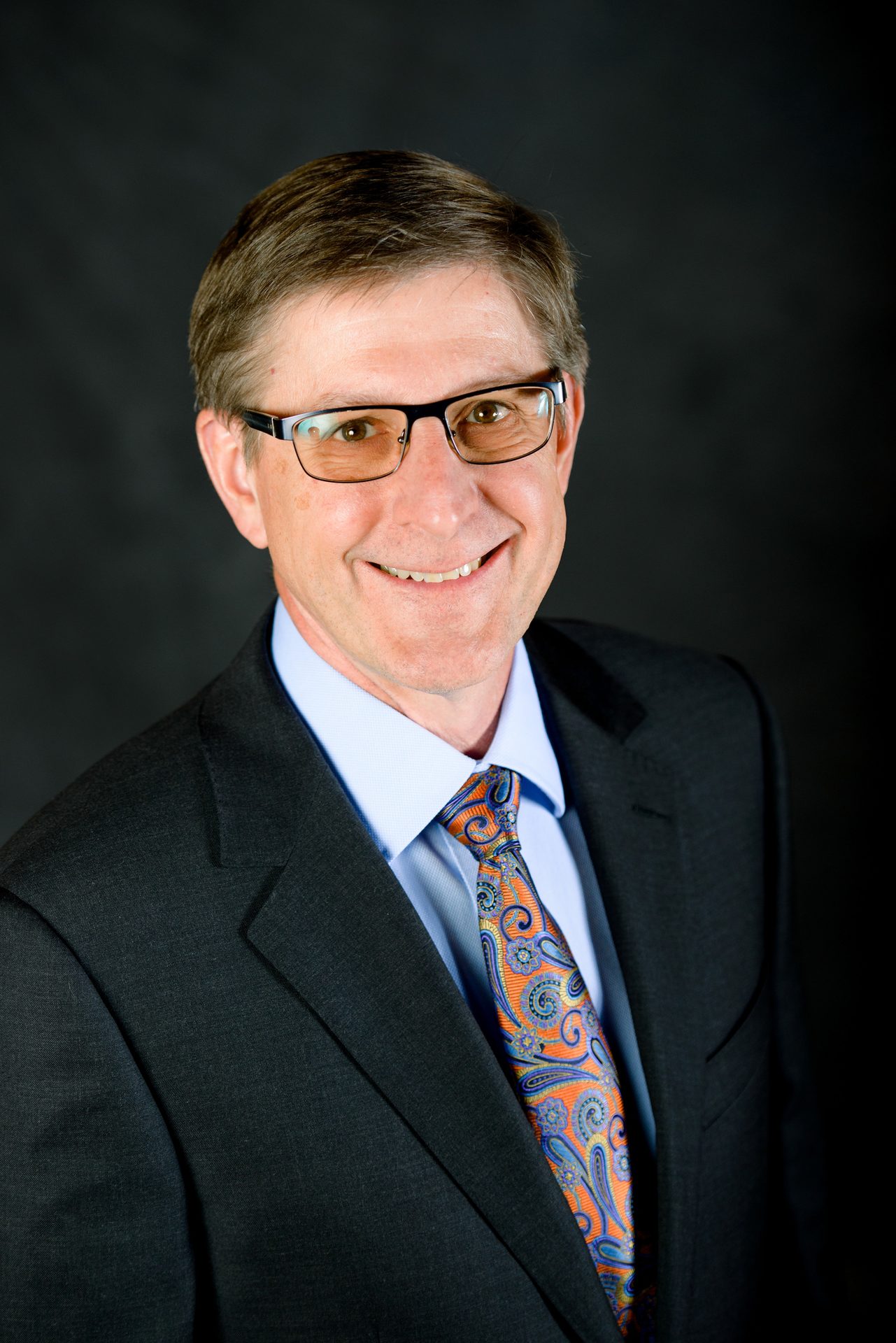 Vision care, Dress shirt, Face, Glasses, Smile, Chin, Coat, Tie, Sleeve