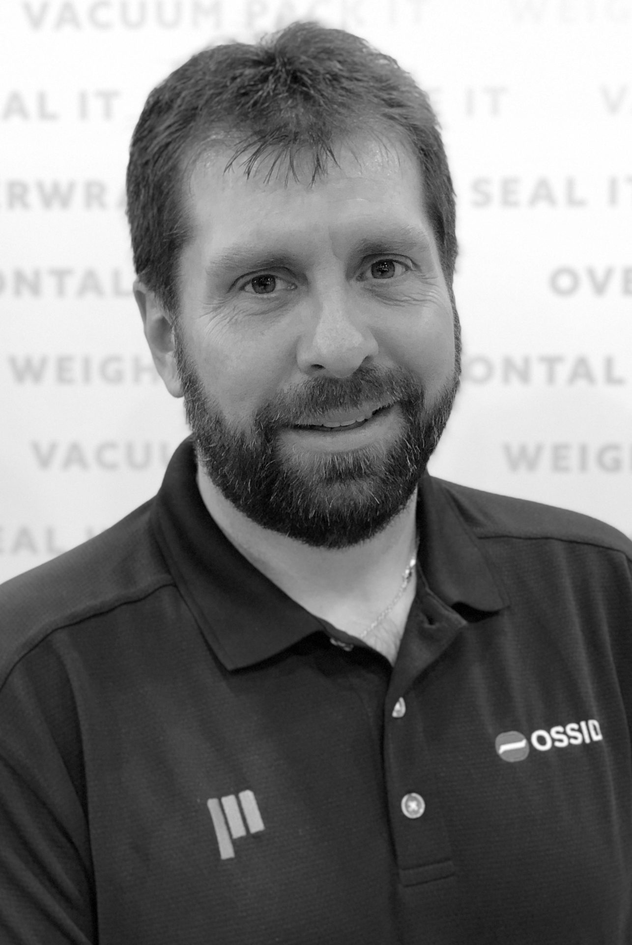 Dress shirt, Forehead, Chin, Beard, Human, Sleeve, Smile, Collar
