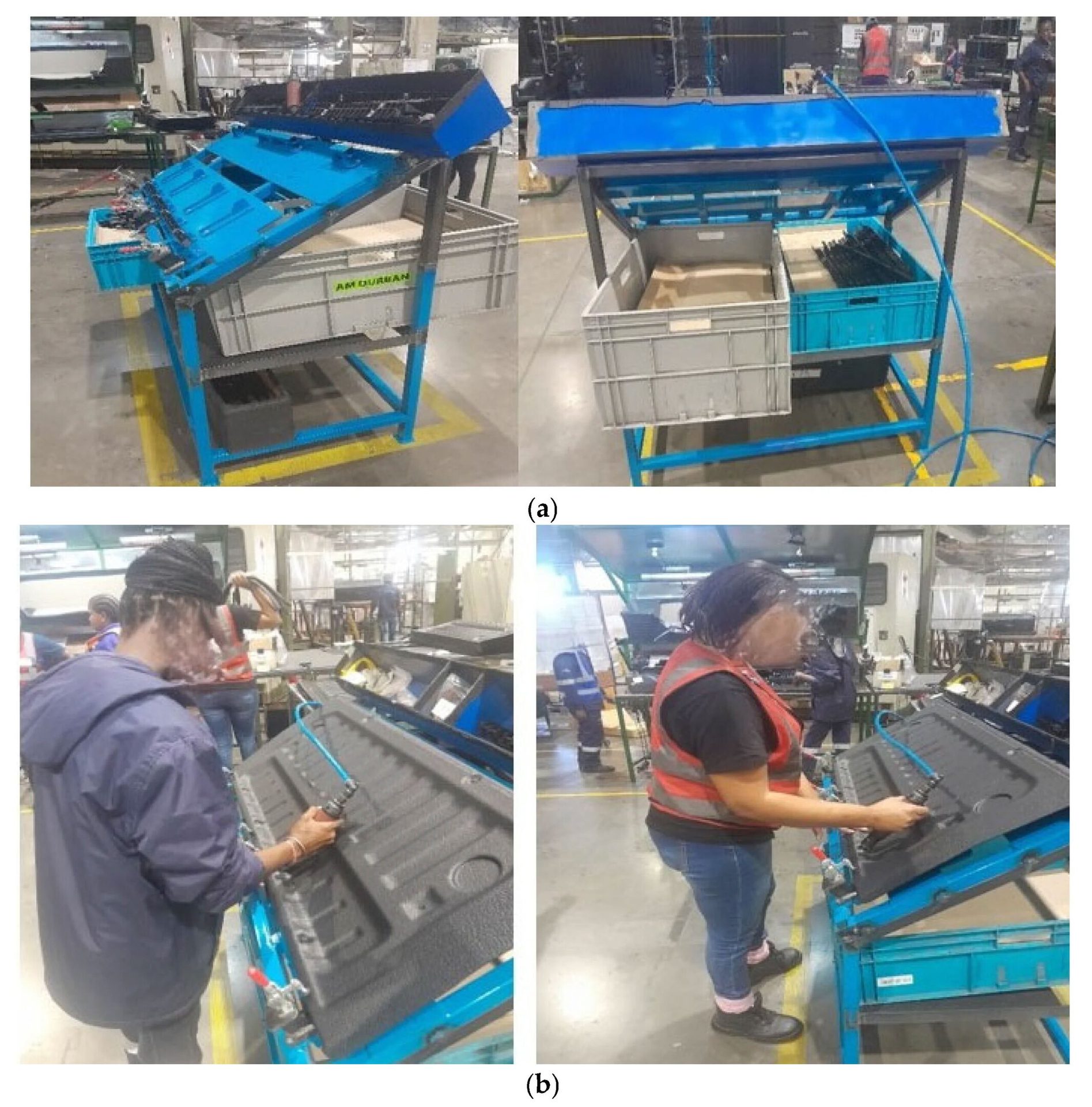 Factory assembly station: workers using a blue jig and tools to attach components to black panels.