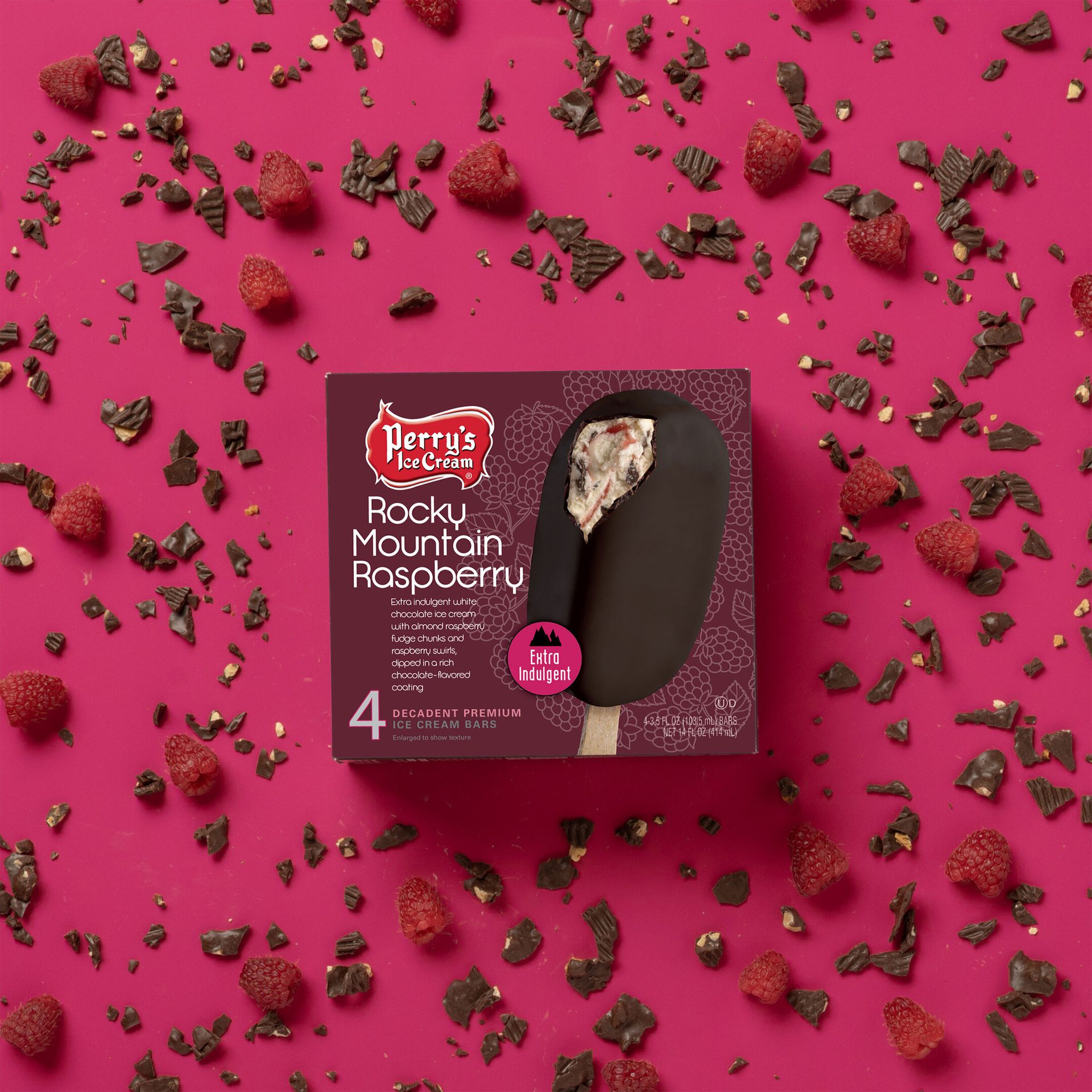 A box of Perry's Rocky Mountain Raspberry ice cream bars, adorned with loose raspberries and chocolate.
