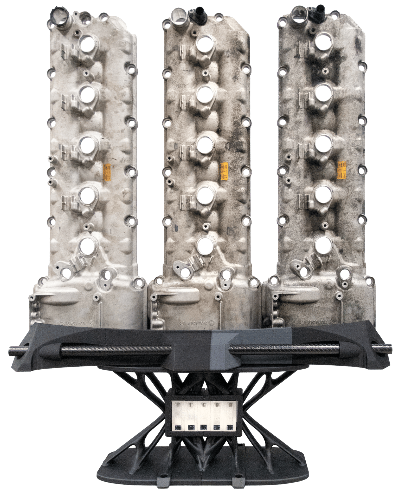 Fig. 1: Aluminum cast valve covers from a V10 engine with a specially designed fixture. 