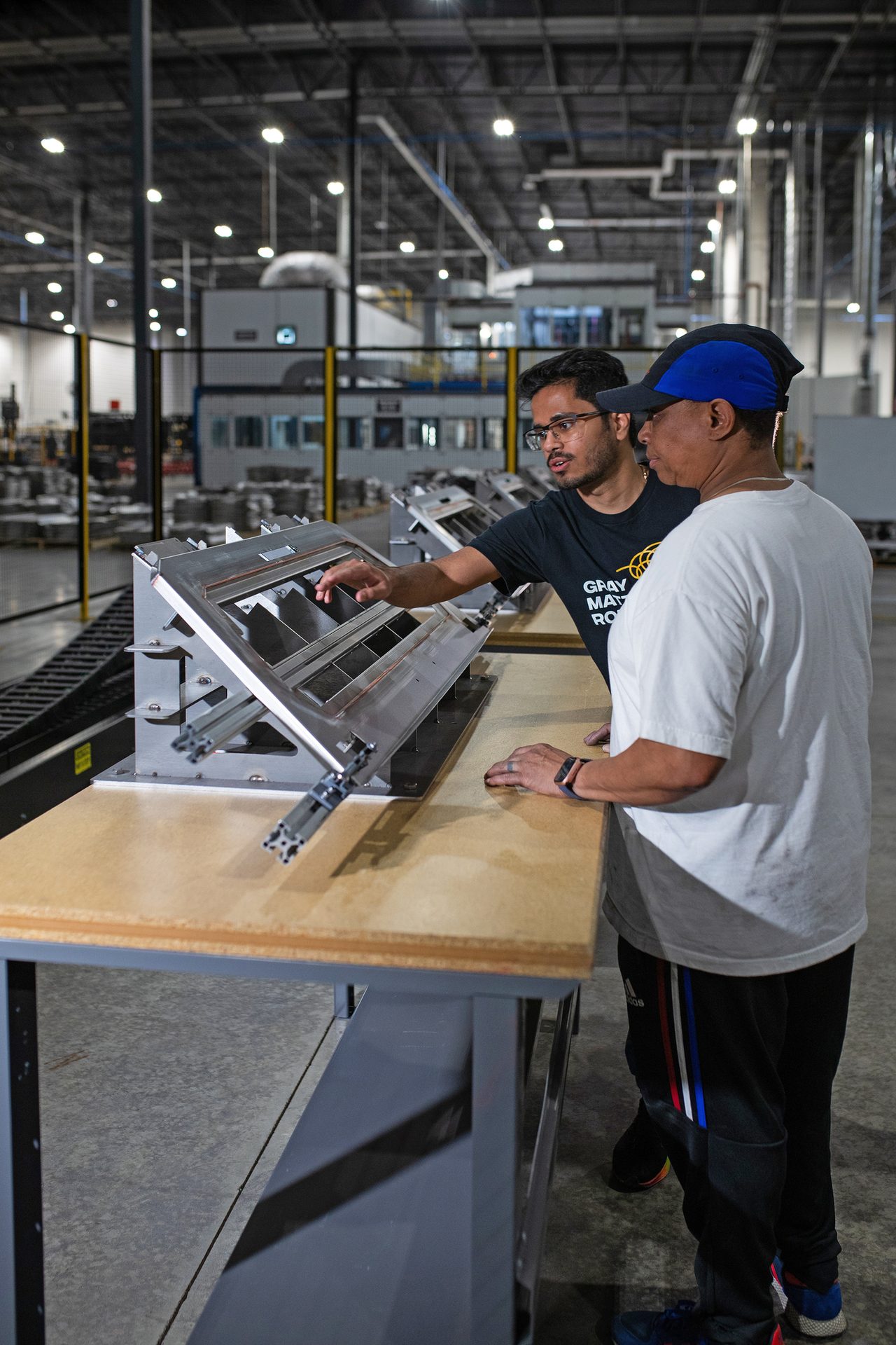 workers inspecting part