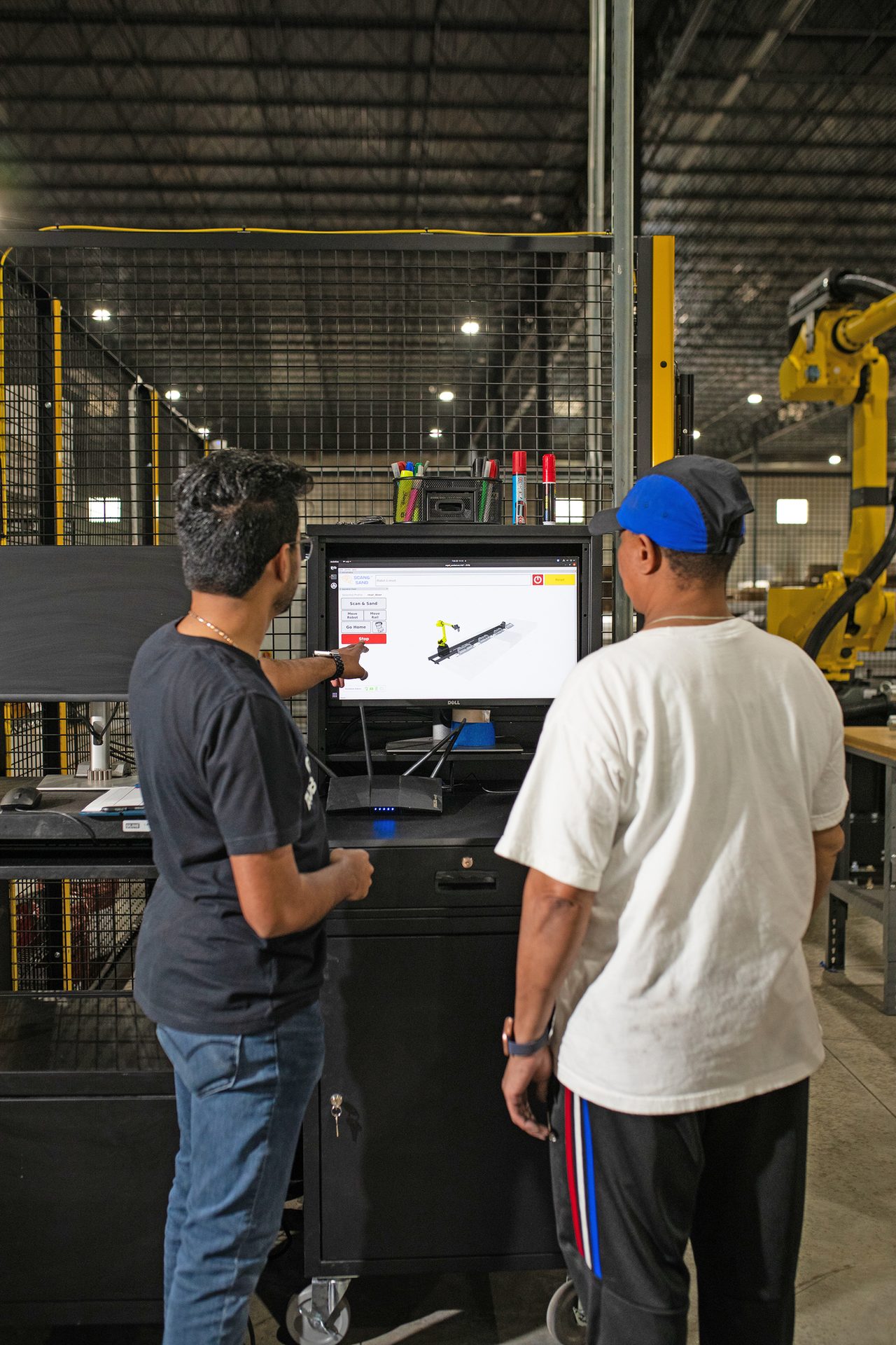 workers using touchscreen with 3D model