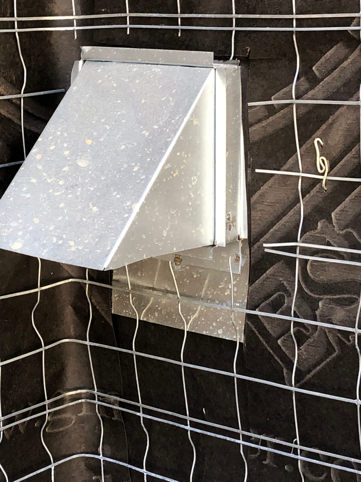 dryer vent on wall before being stuccoed