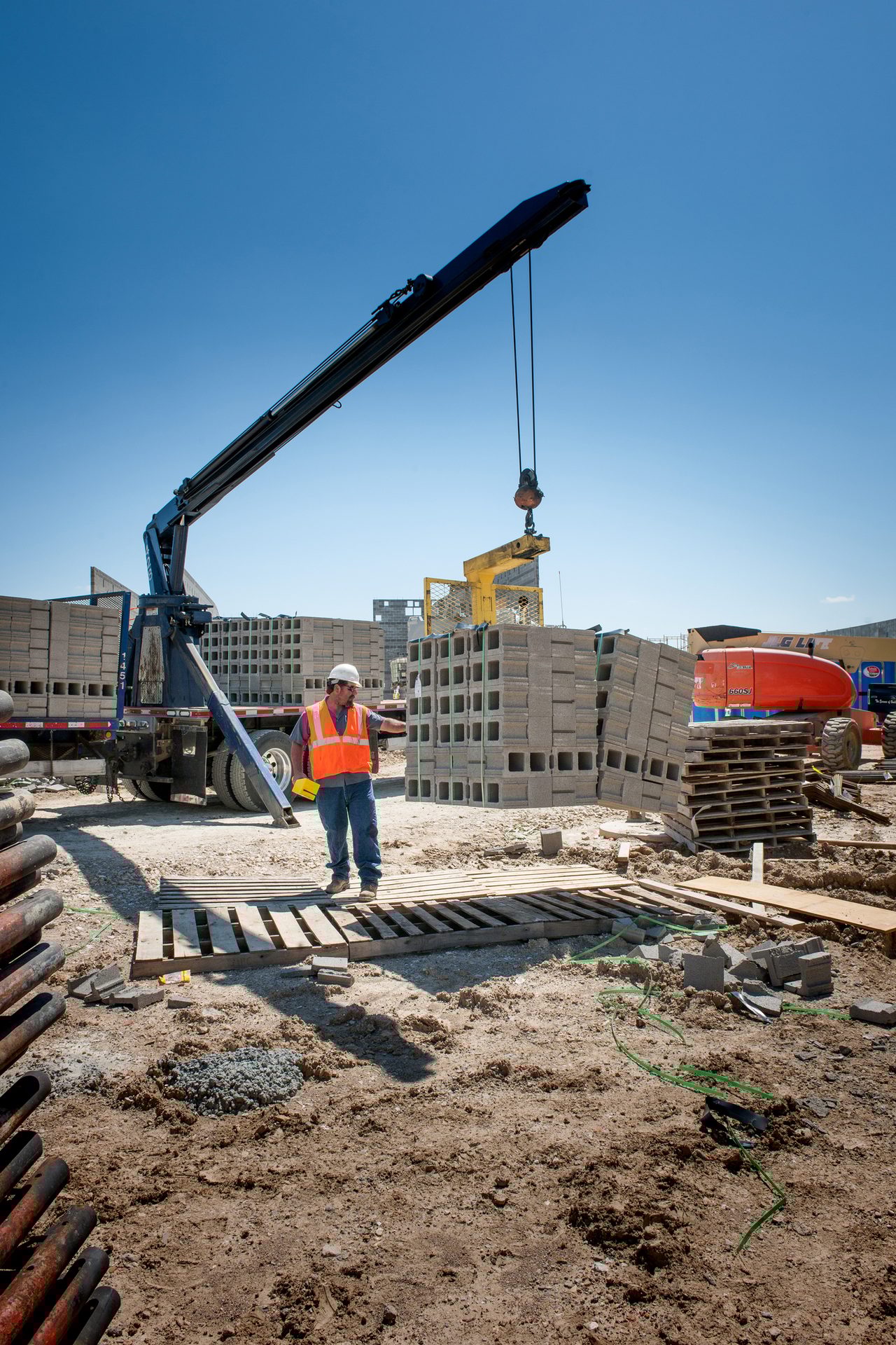 Road surface, Construction worker, Composite material, Sky, Asphalt, Building, Wood