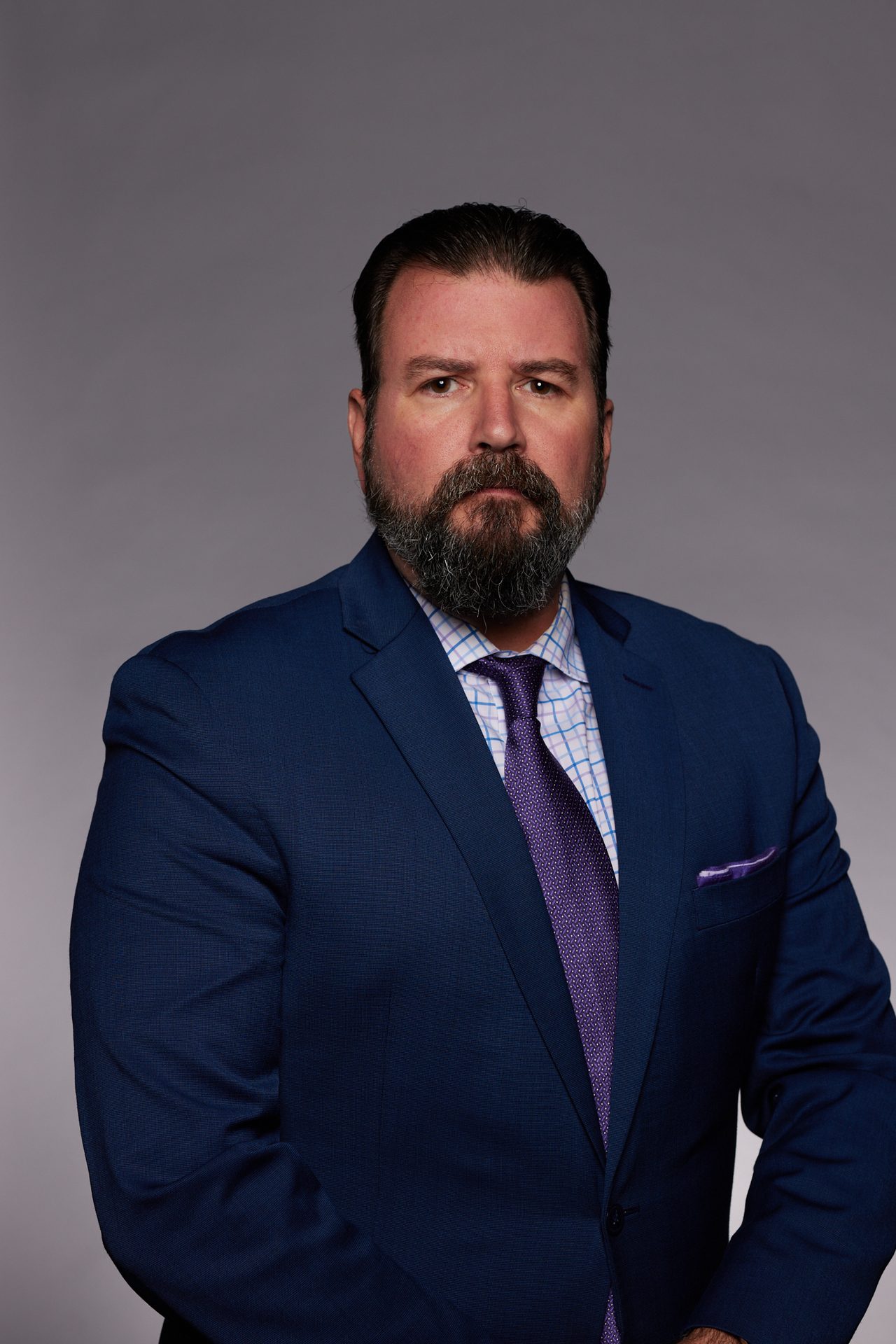 Formal wear, Facial hair, Chin, Eyebrow, Sleeve, Forehead, Collar, Face, Shoulder, Jaw