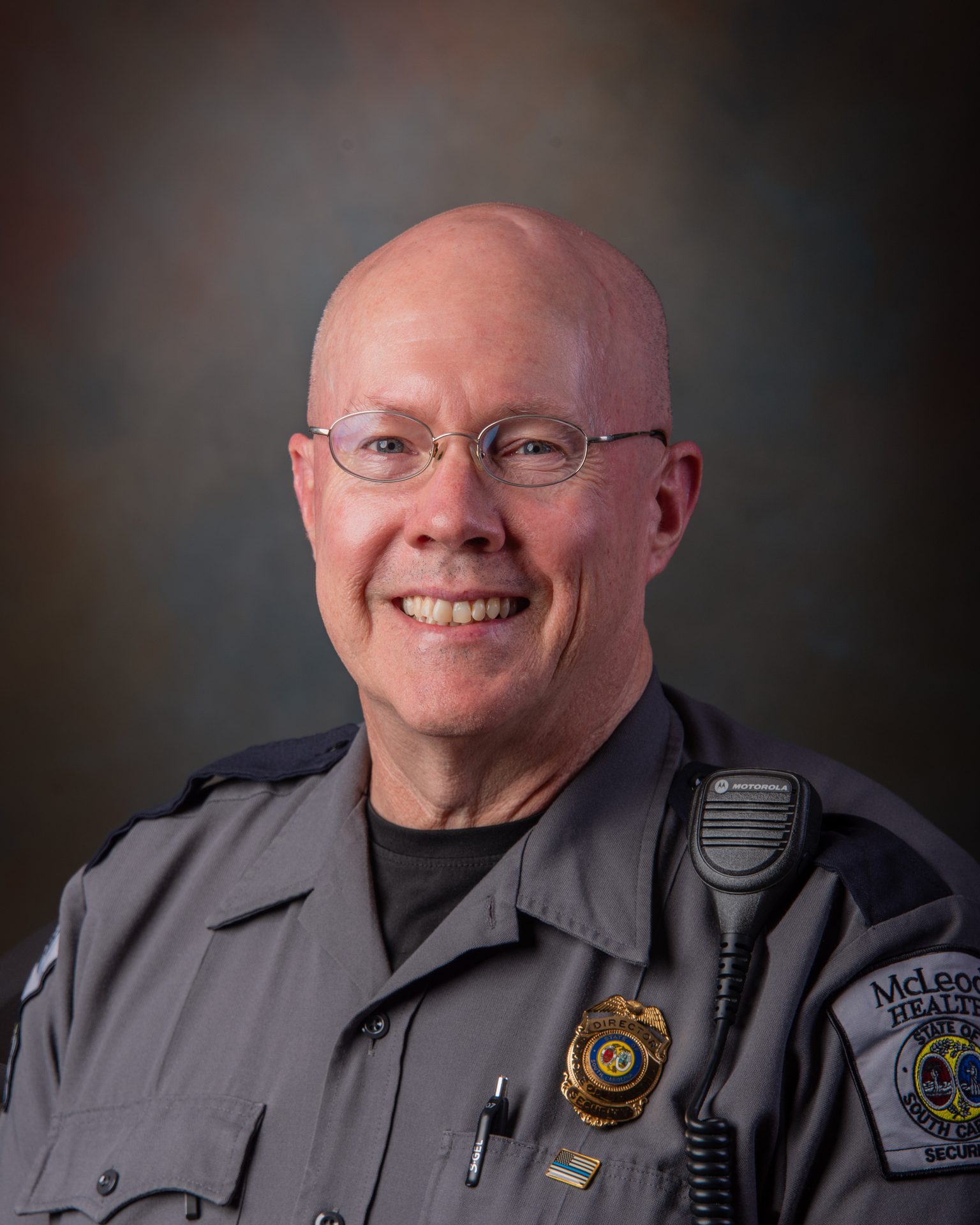 Dress shirt, Military uniform, Glasses, Smile, Sleeve, Gesture, Collar