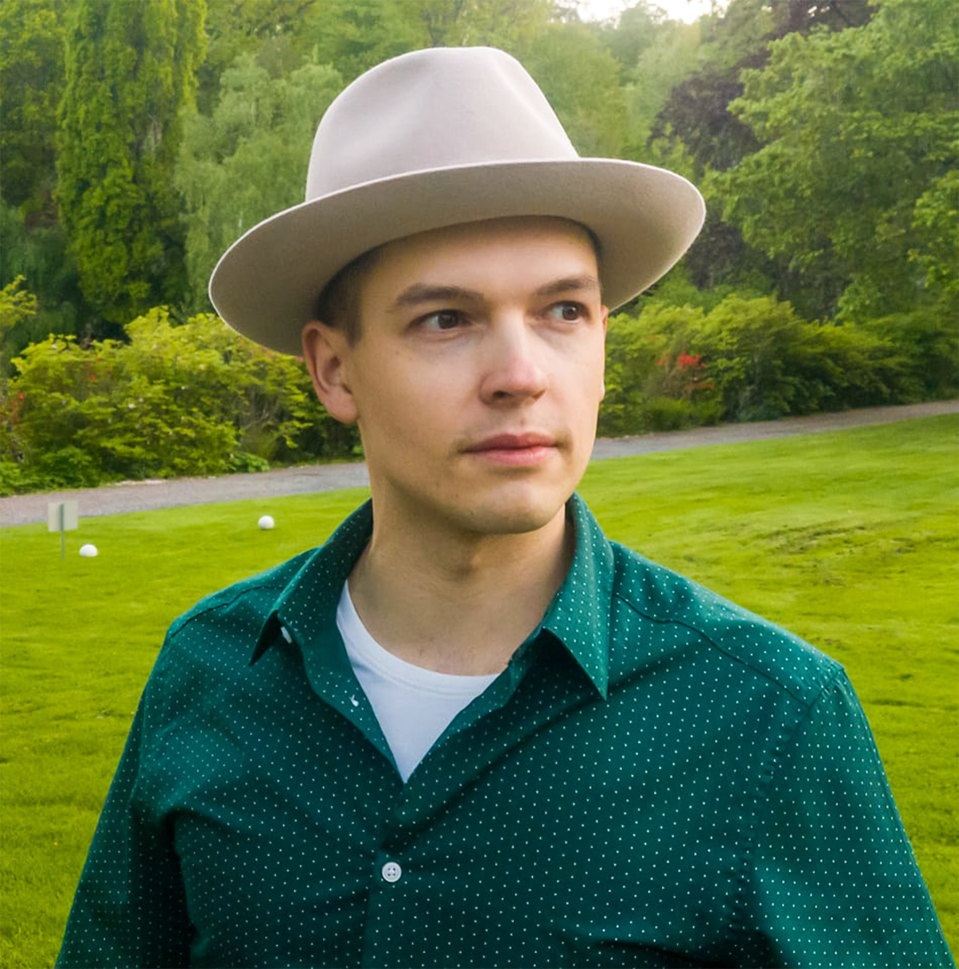 People in nature, Natural environment, Dress shirt, Face, Lip, Hat, Green, Fedora, Leaf