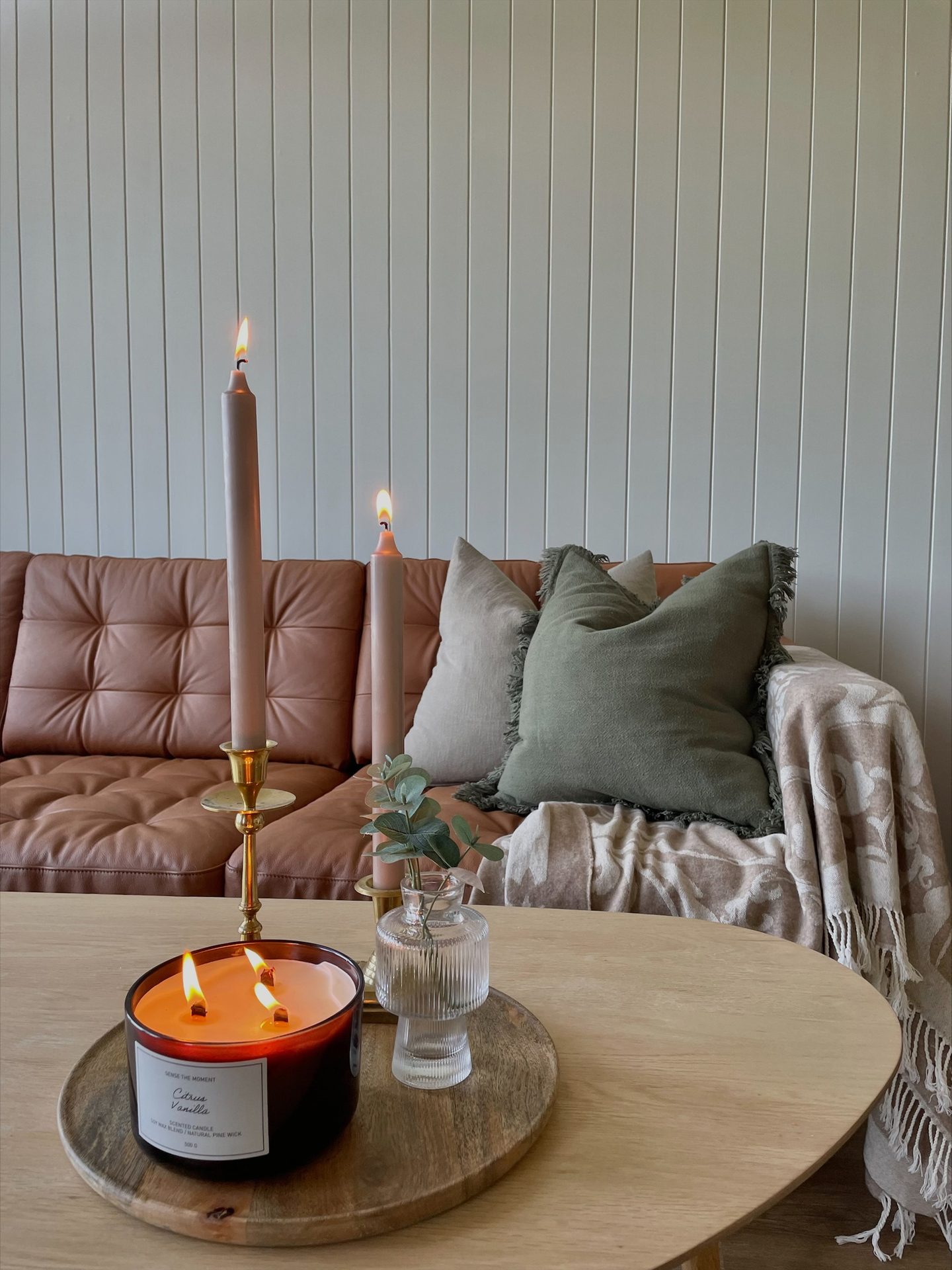 Interior design, Table, Furniture, Couch, Candle, Rectangle, Wood, Lighting, Comfort, Orange