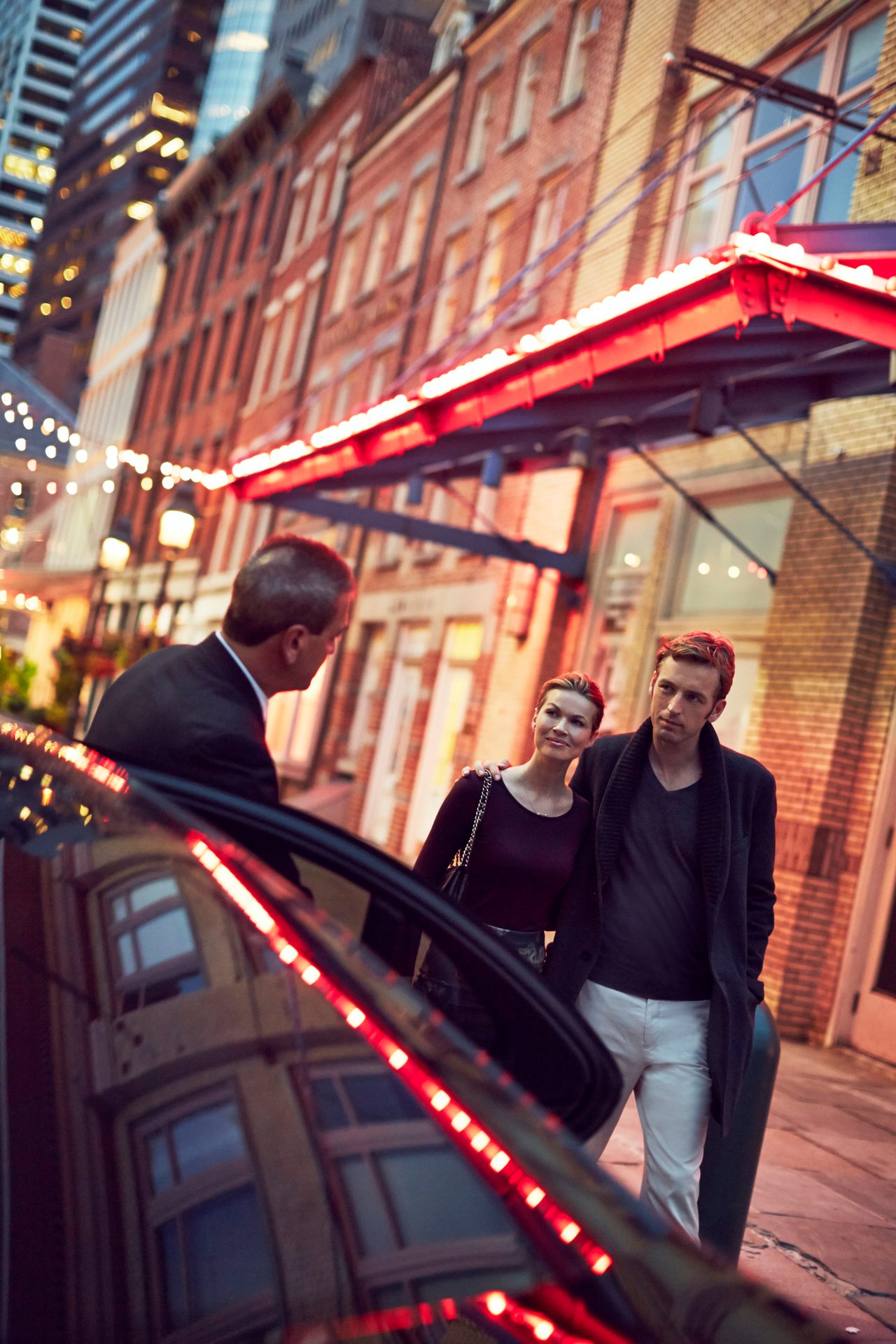 Automotive lighting, Outerwear, Smile, Window, Building, Light, Coat, Red