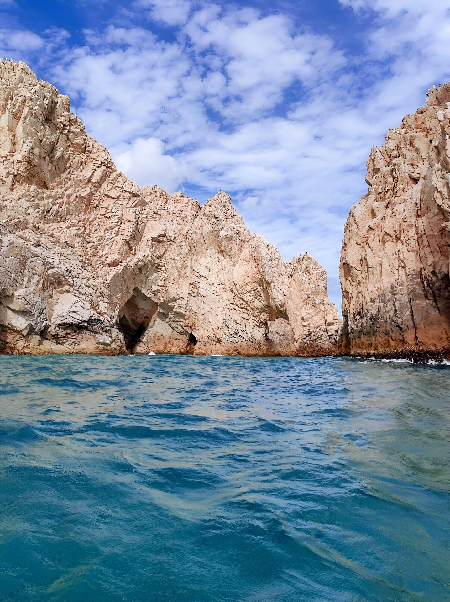 Coastal and oceanic landforms, Natural landscape, Cloud, Water, Sky, Blue, Azure, Mountain, Watercourse, Bedrock