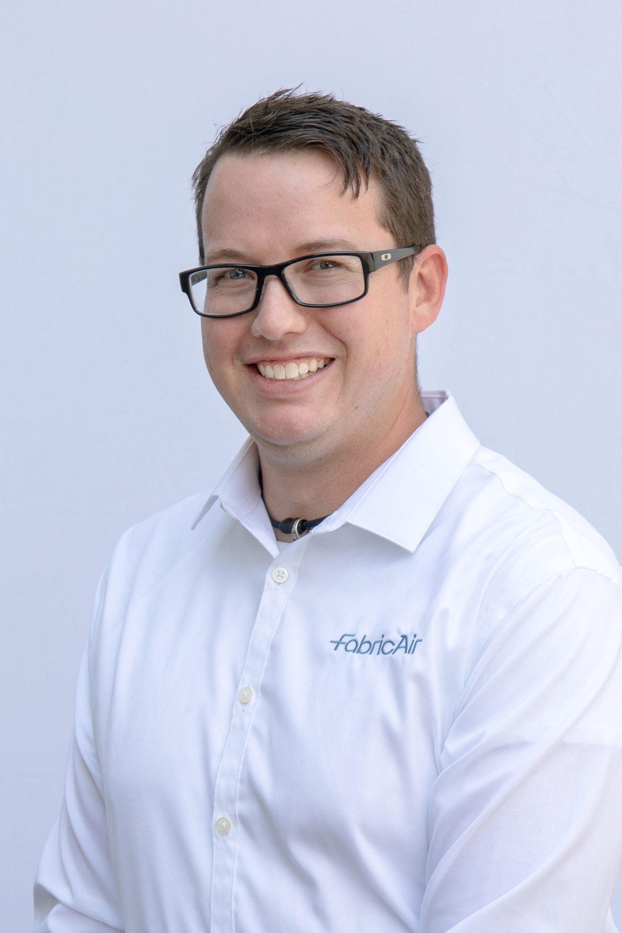 Vision care, Dress shirt, Forehead, Glasses, Smile, Chin, Jaw, Sleeve, Gesture