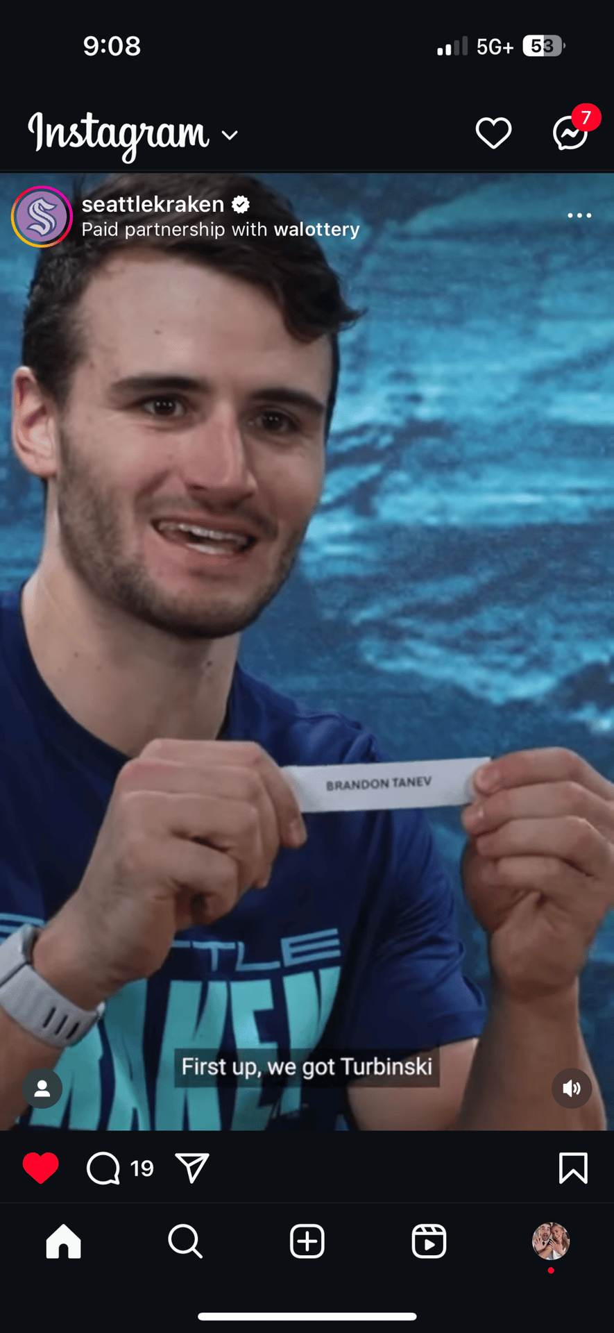 Instagram: Seattle Kraken man holds 'BRANDON TANEV' paper. On-screen text: 'First up, we got Turbinski'.