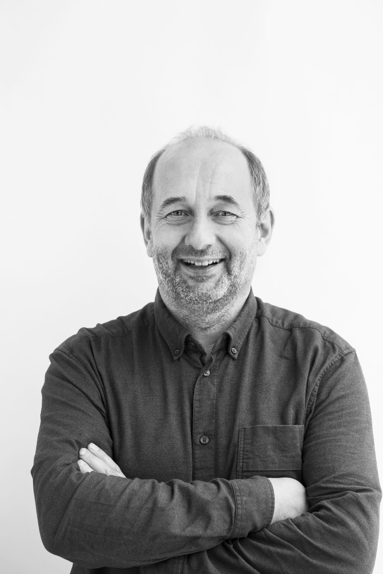 Dress shirt, Flash photography, Smile, Sleeve, Standing, Gesture, Collar, Beard, Happy