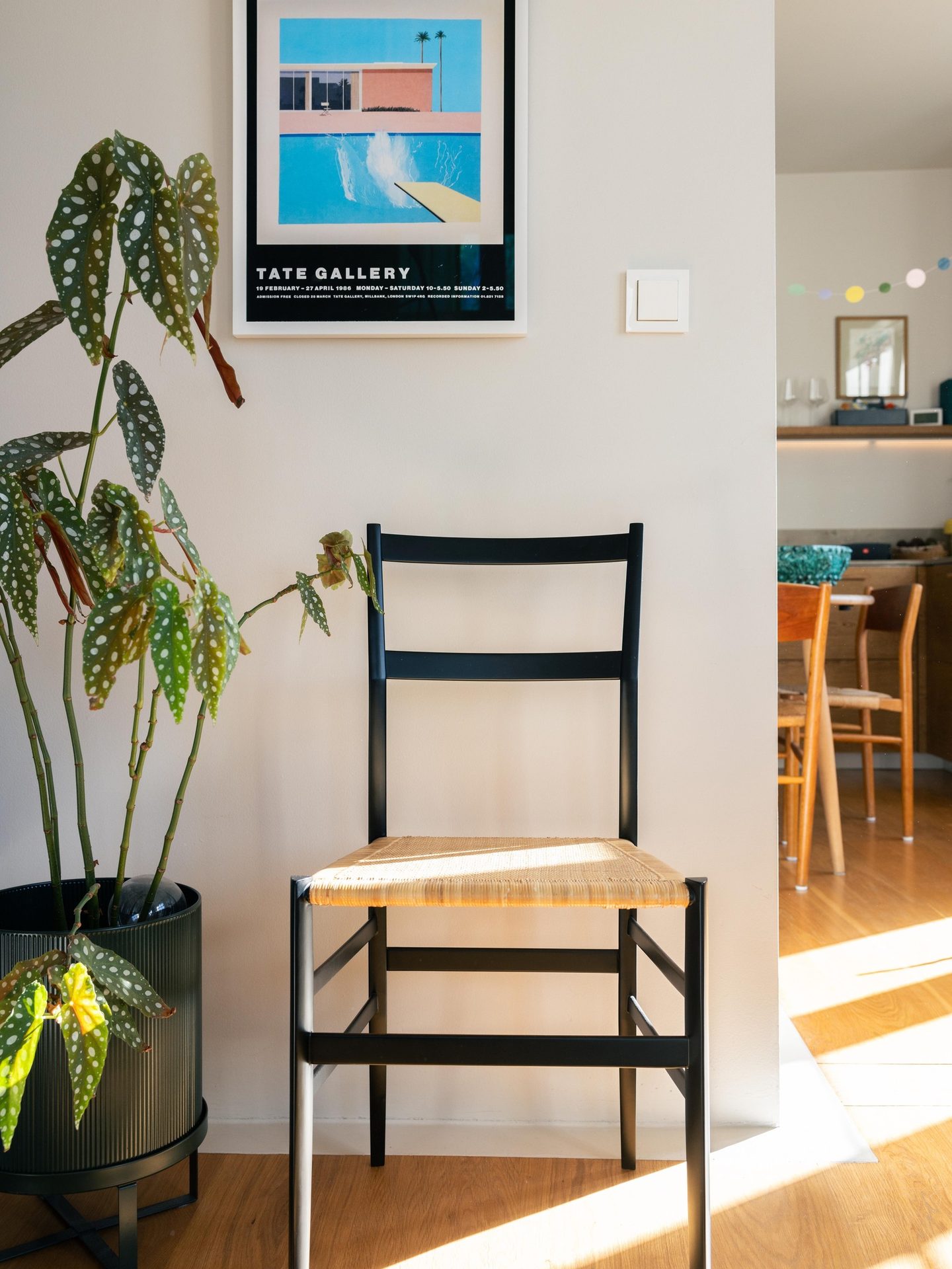 Interior design, Picture frame, Plant, Furniture, Table, Chair, Yellow, Building, Wood, Houseplant
