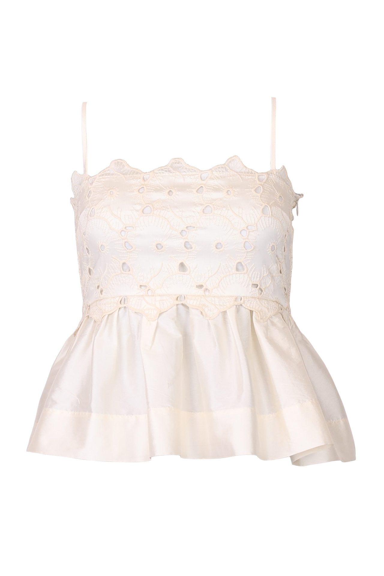 Cream eyelet lace peplum top with spaghetti straps and a ruffled hem.
