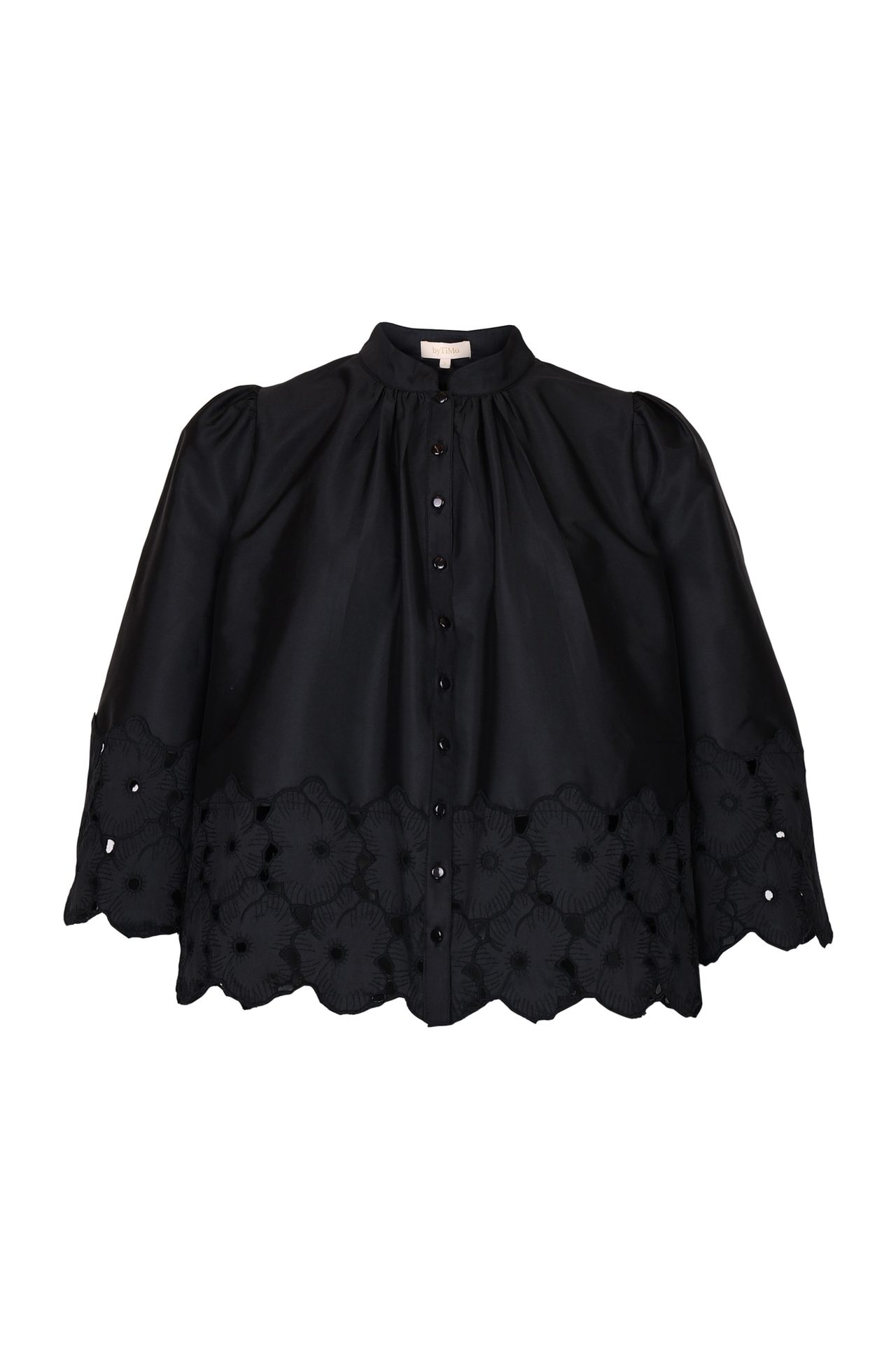 Black puff-sleeve blouse with a high collar and floral cut-out scalloped hem.