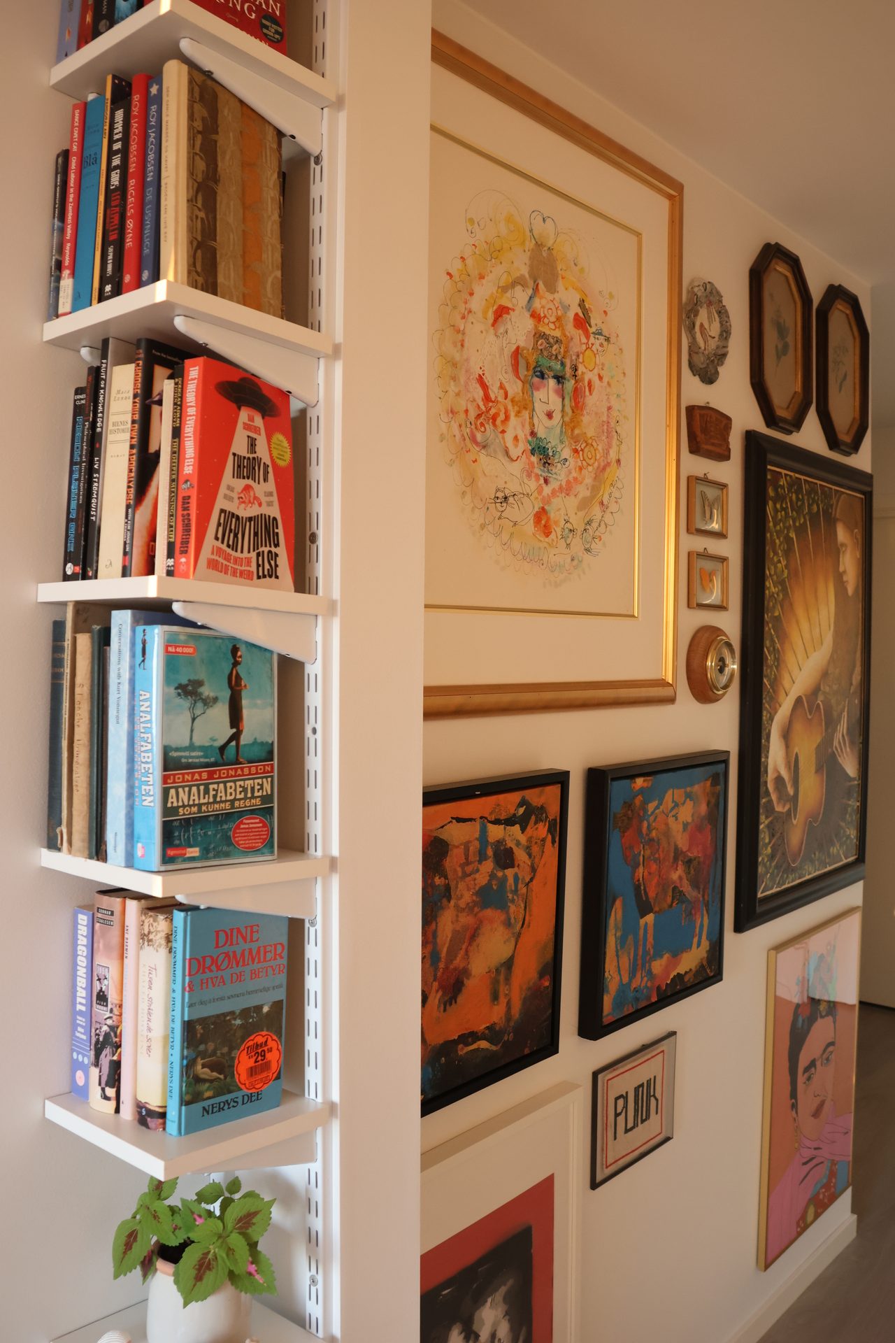 Picture frame, Interior design, Property, Shelf, Bookcase, Shelving, Art, Paint, Publication, Wall