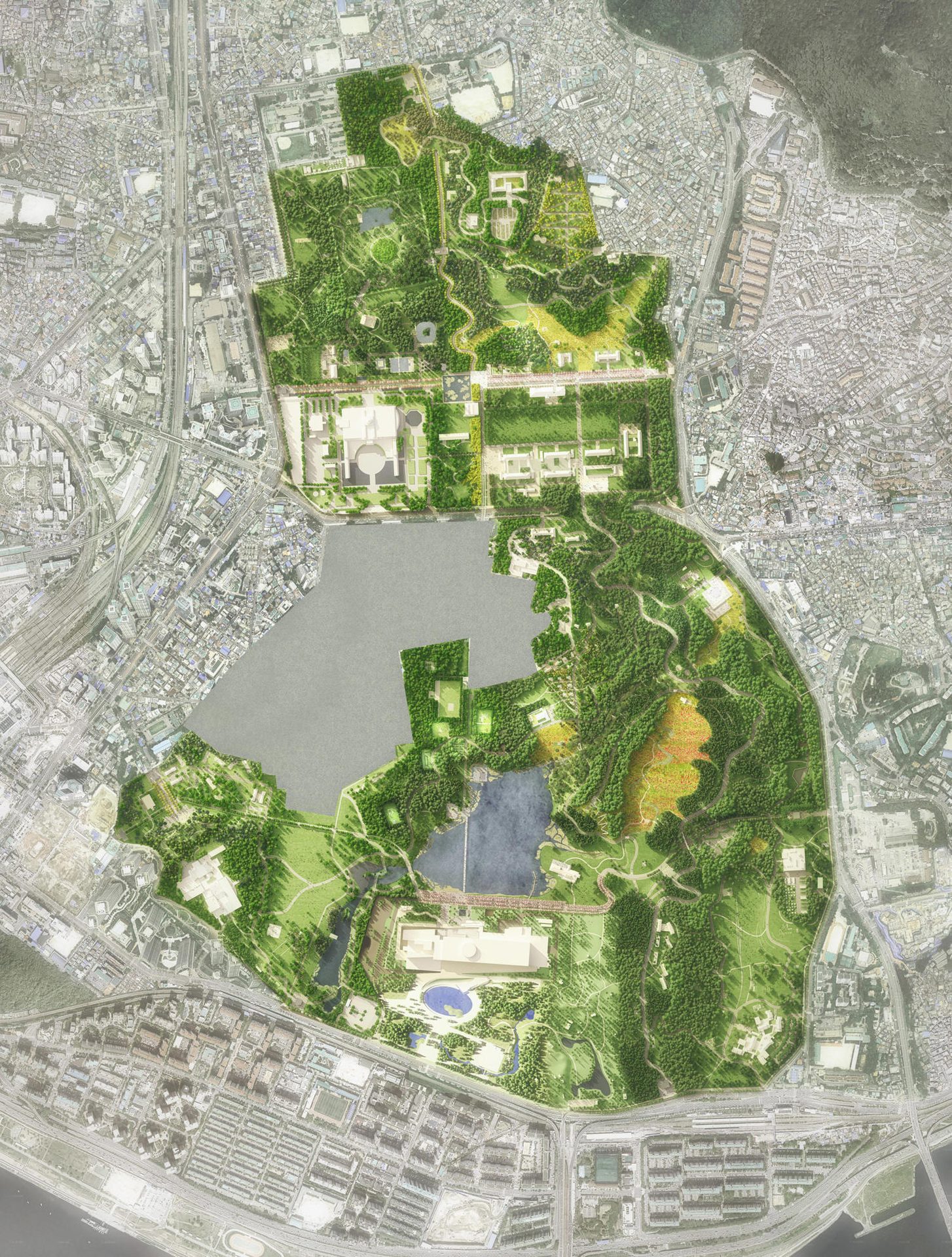 Overhead view of a large green park with lakes and buildings, integrated within a grey urban landscape.