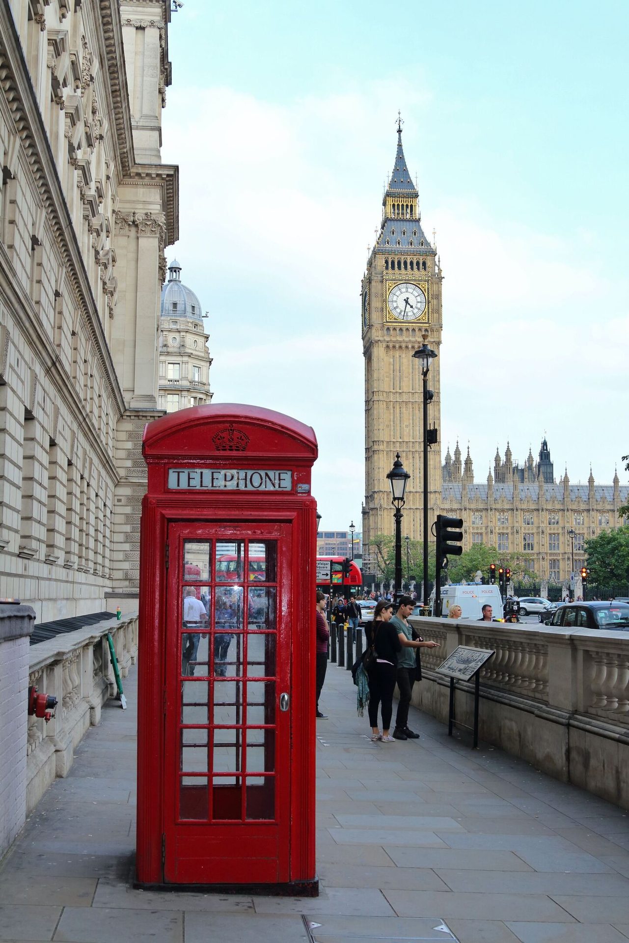 Telephone booth, Public space, Sky, Building, Cloud, Tower, Clock, Payphone